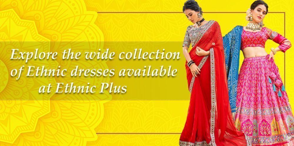 Two women wearing colorful Indian ethnic dresses, saree and lehenga, on a yellow patterned background