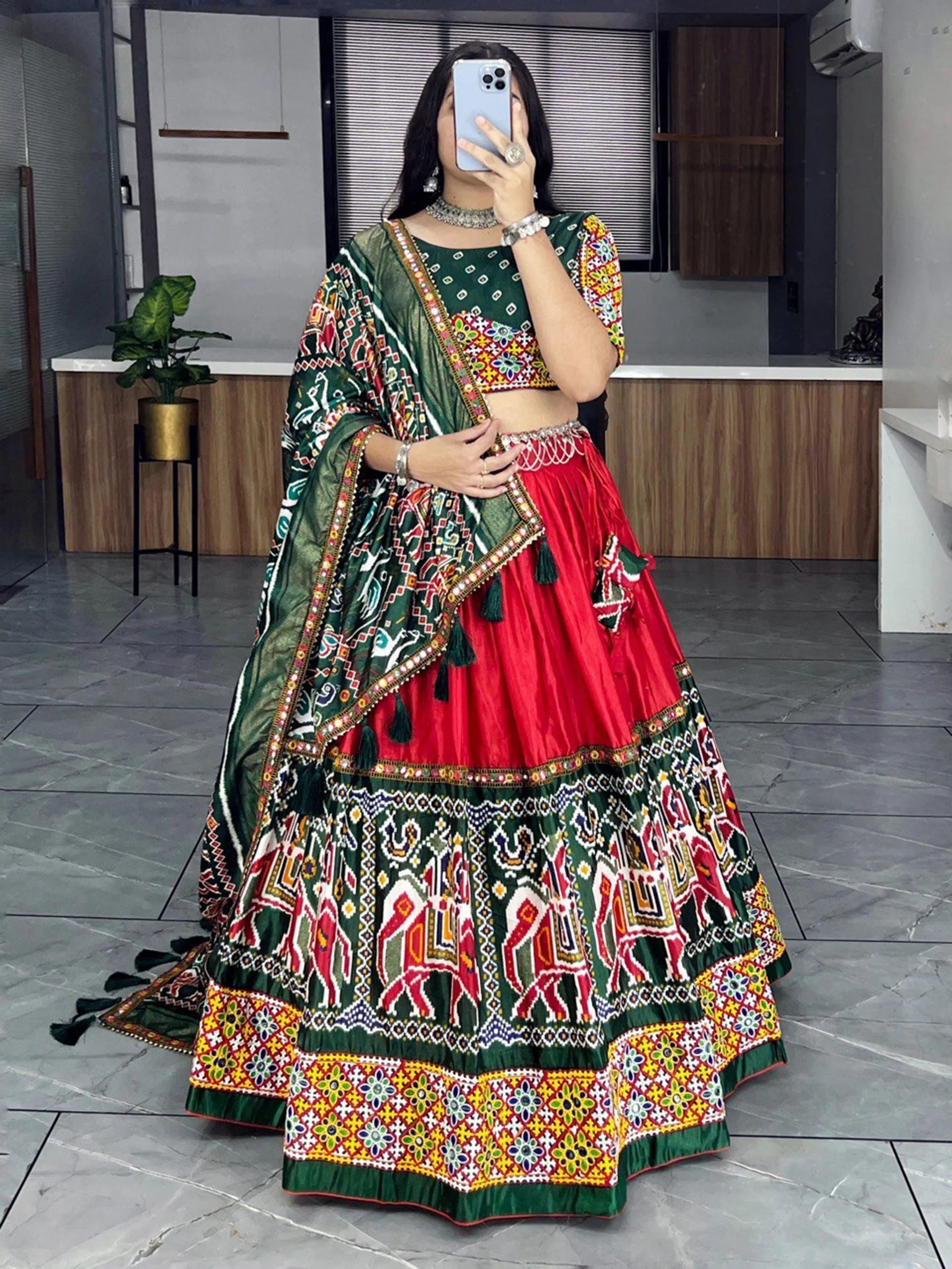 Woman in vibrant Navratri lehenga choli with traditional embroidery and mirror work