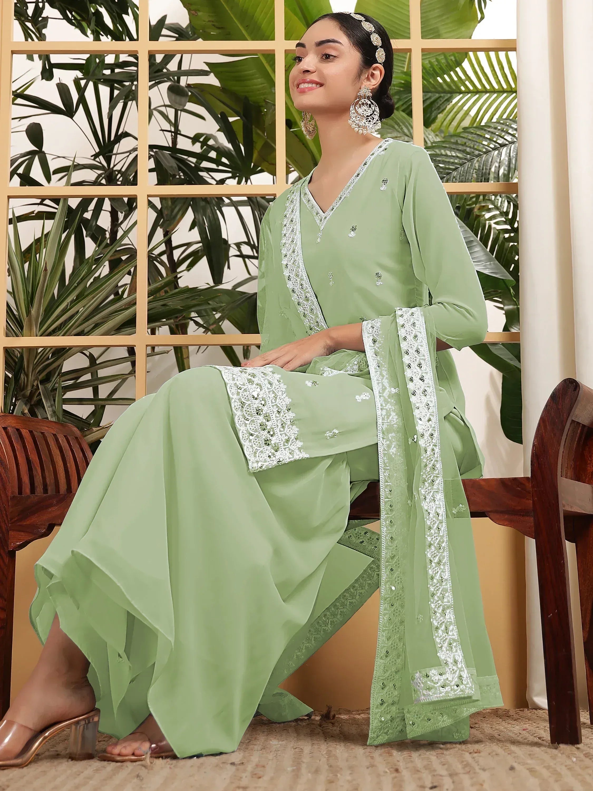 Mint green embroidered salwar kameez with white lace detailing, perfect for ethnic occasions