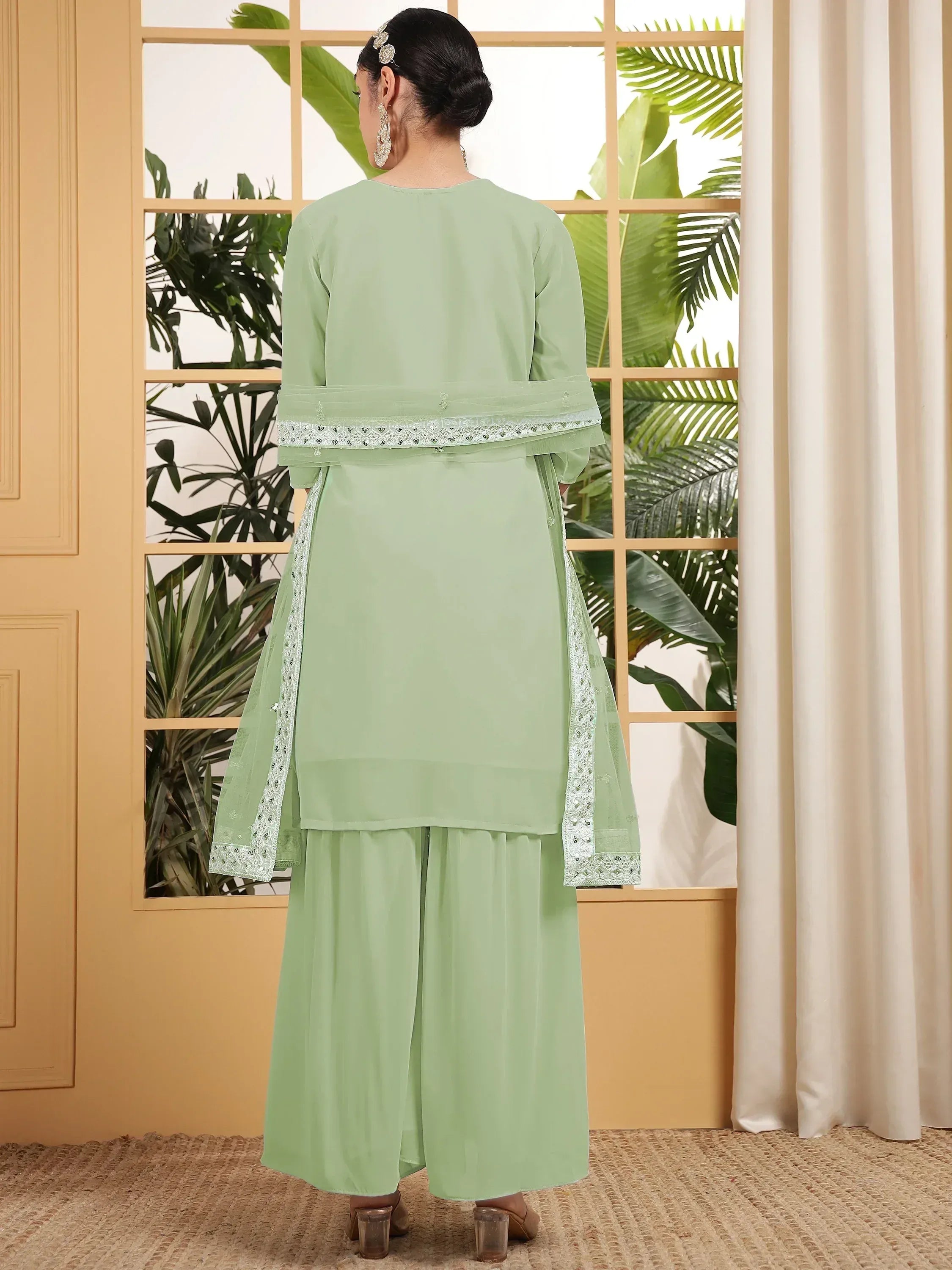 Mint green ethnic salwar kameez with embroidered dupatta, perfect for Indian festive wear