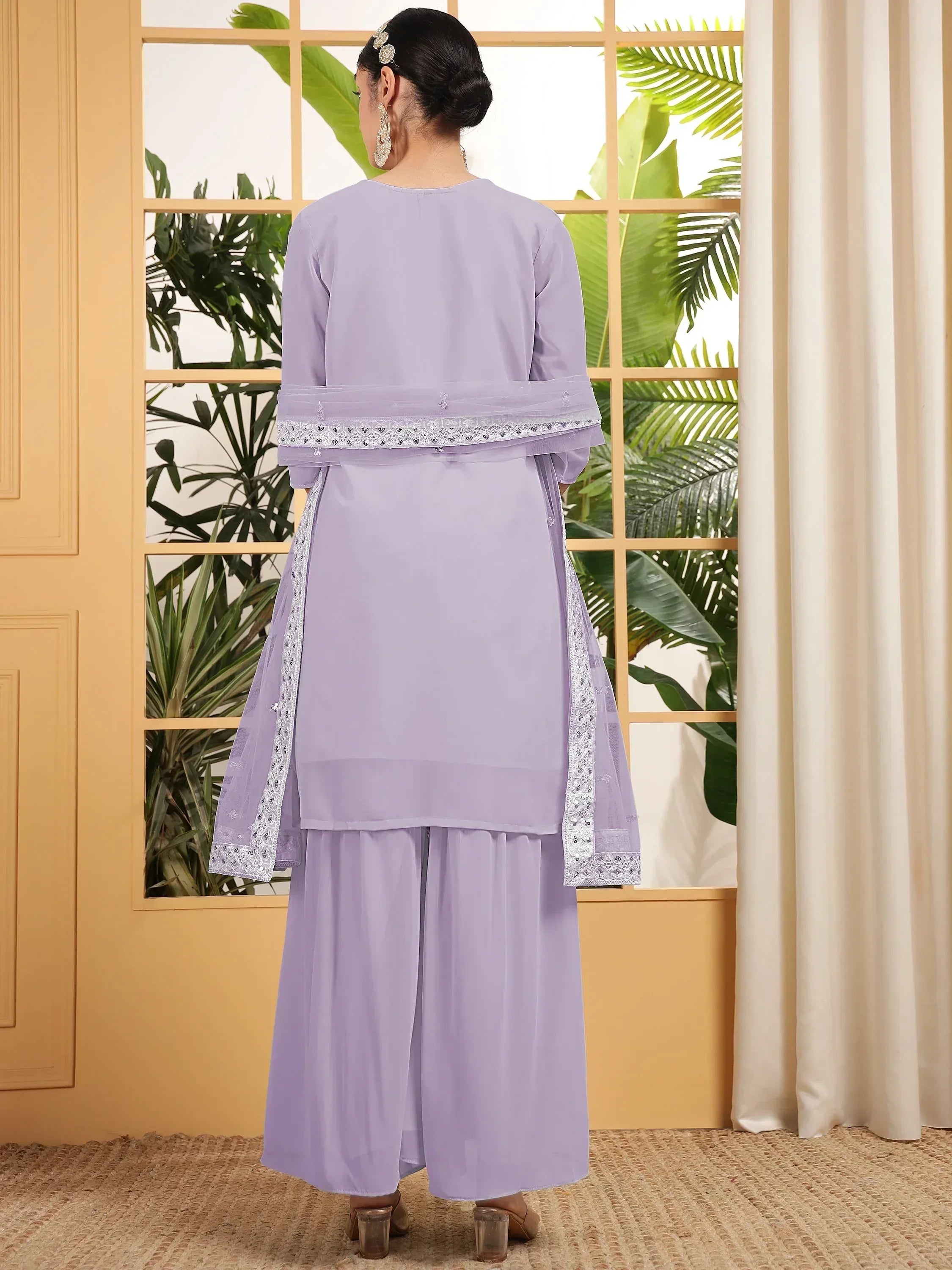 Lavender ethnic salwar kameez with lace detailing, perfect for Indian festive wear