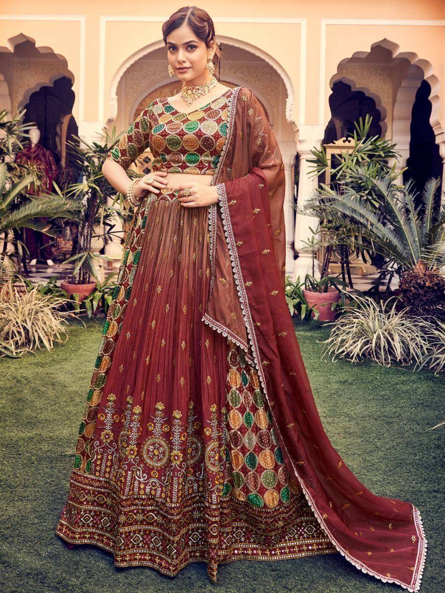 Maroon embroidered lehenga choli with mirror work, perfect for Indian ethnic wear and festive occasions.
