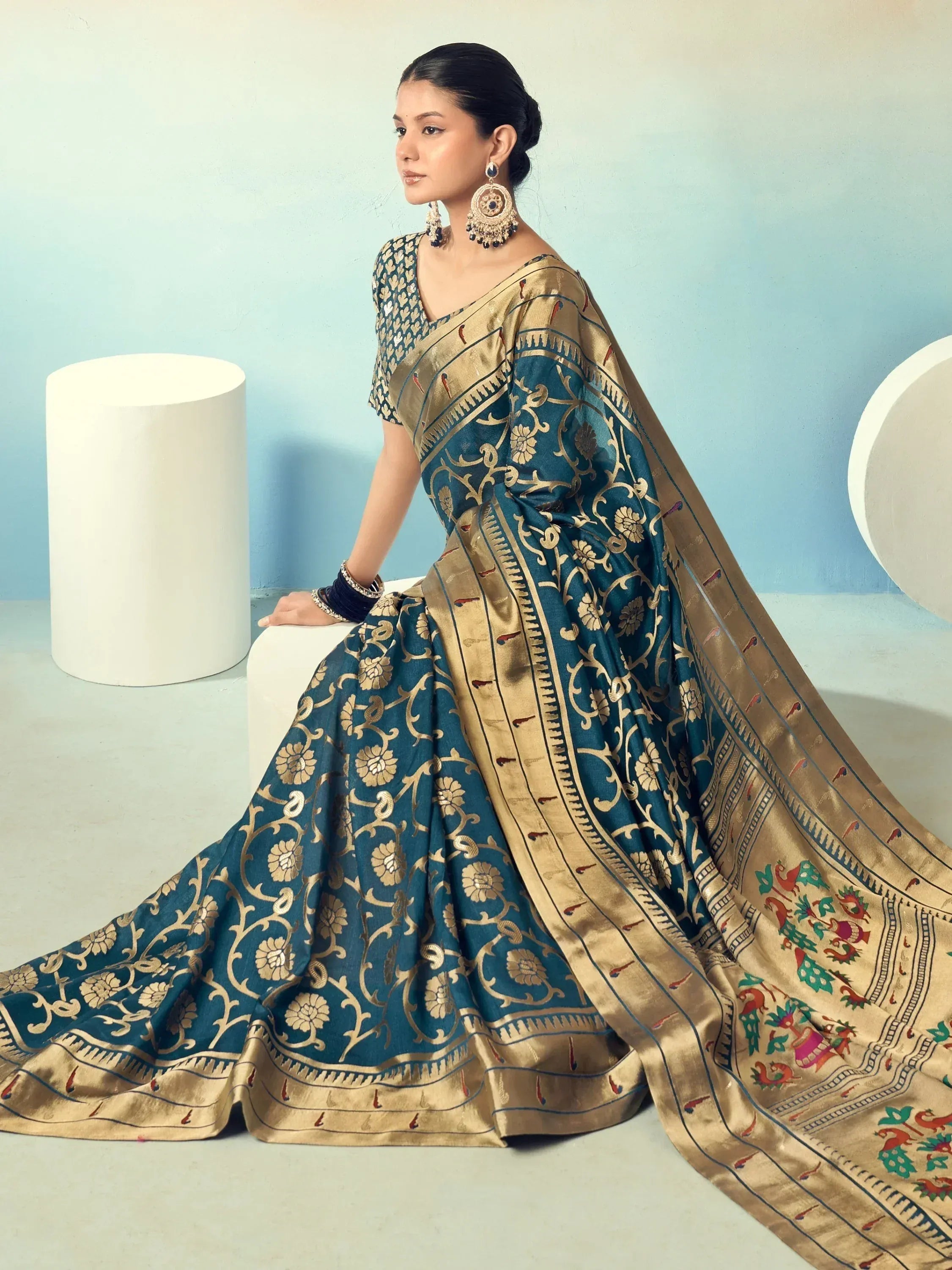 Elegant teal and gold embroidered saree with floral motifs, perfect for Indian ethnic occasions