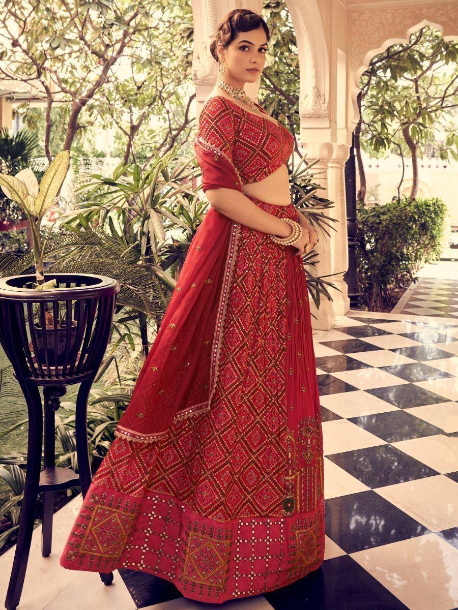 Red embroidered lehenga choli with gold detailing, perfect for Indian ethnic wear occasions