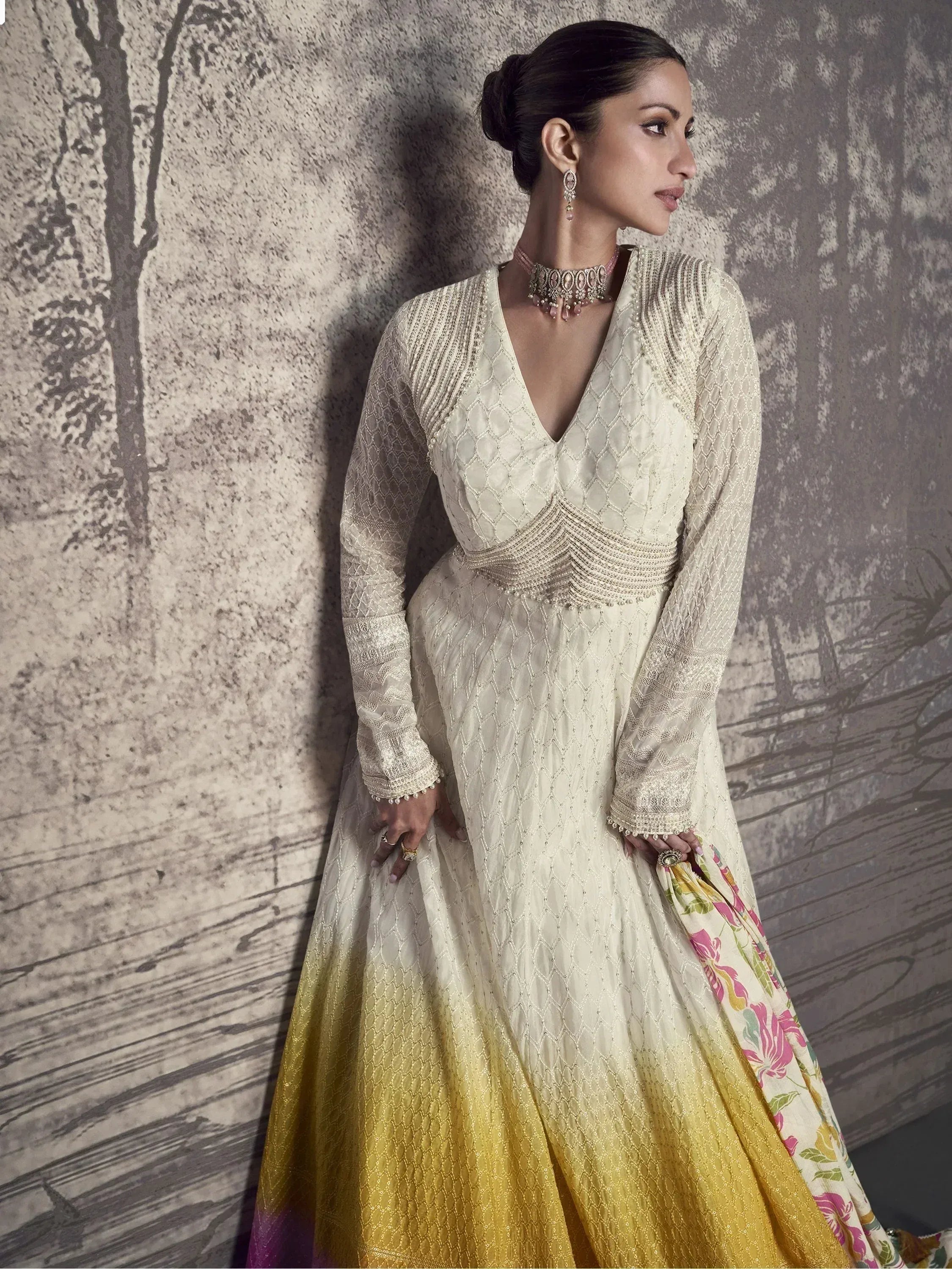 Elegant cream and gold embroidered anarkali gown with floral dupatta, perfect for Indian ethnic occasions.