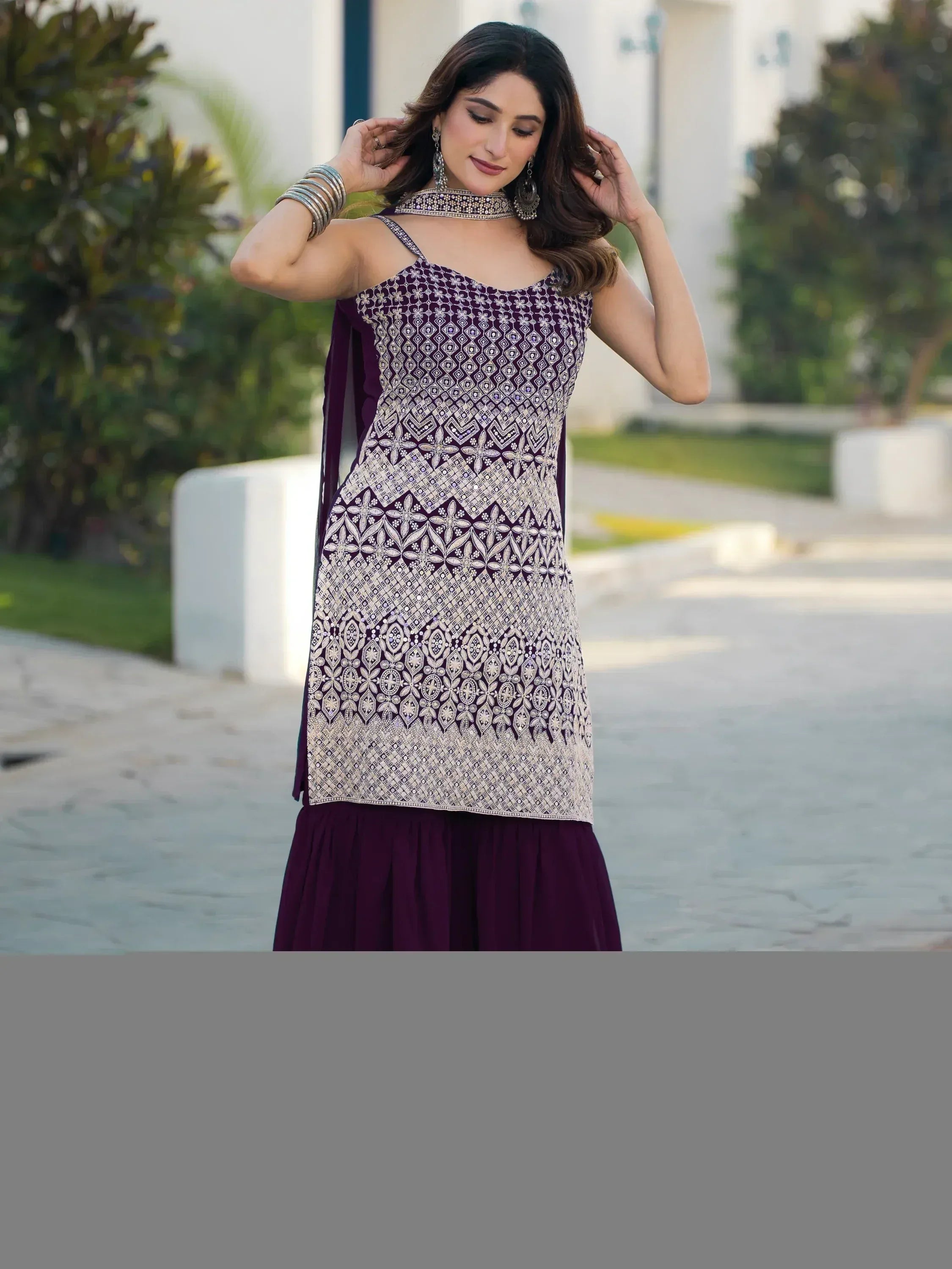 Elegant purple ethnic gown with intricate white embroidery and matching accessories