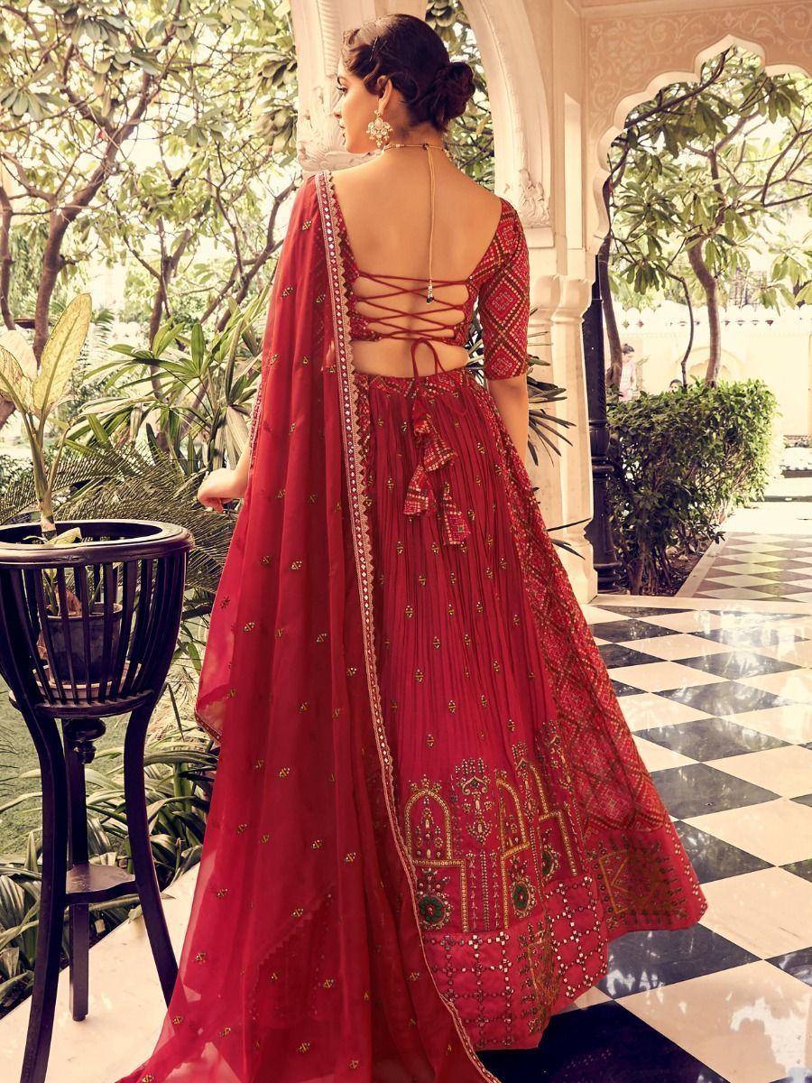 Red embroidered lehenga choli with back tie-up, perfect for Indian weddings and festive occasions