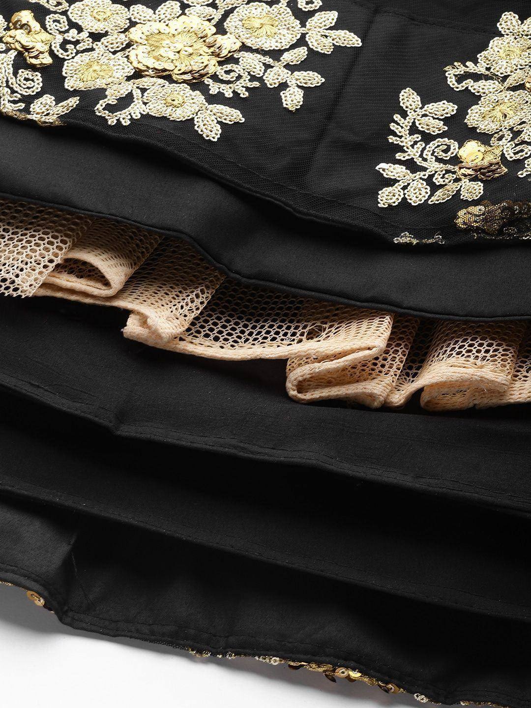 Black ethnic gown with gold floral embroidery and beige lace trim, perfect for Indian occasions.