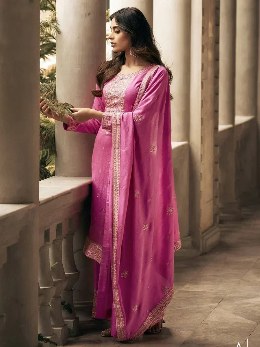 Pink embroidered salwar kameez with gold detailing, perfect for ethnic occasions