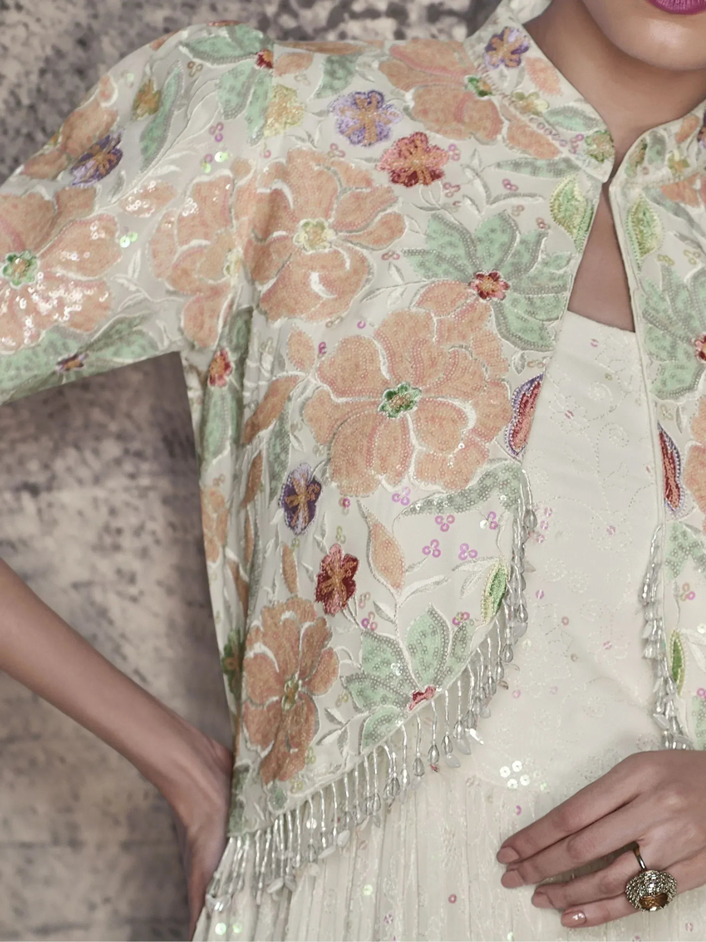 Floral embroidered ethnic gown with sequins and tassels, perfect for Indian festive occasions