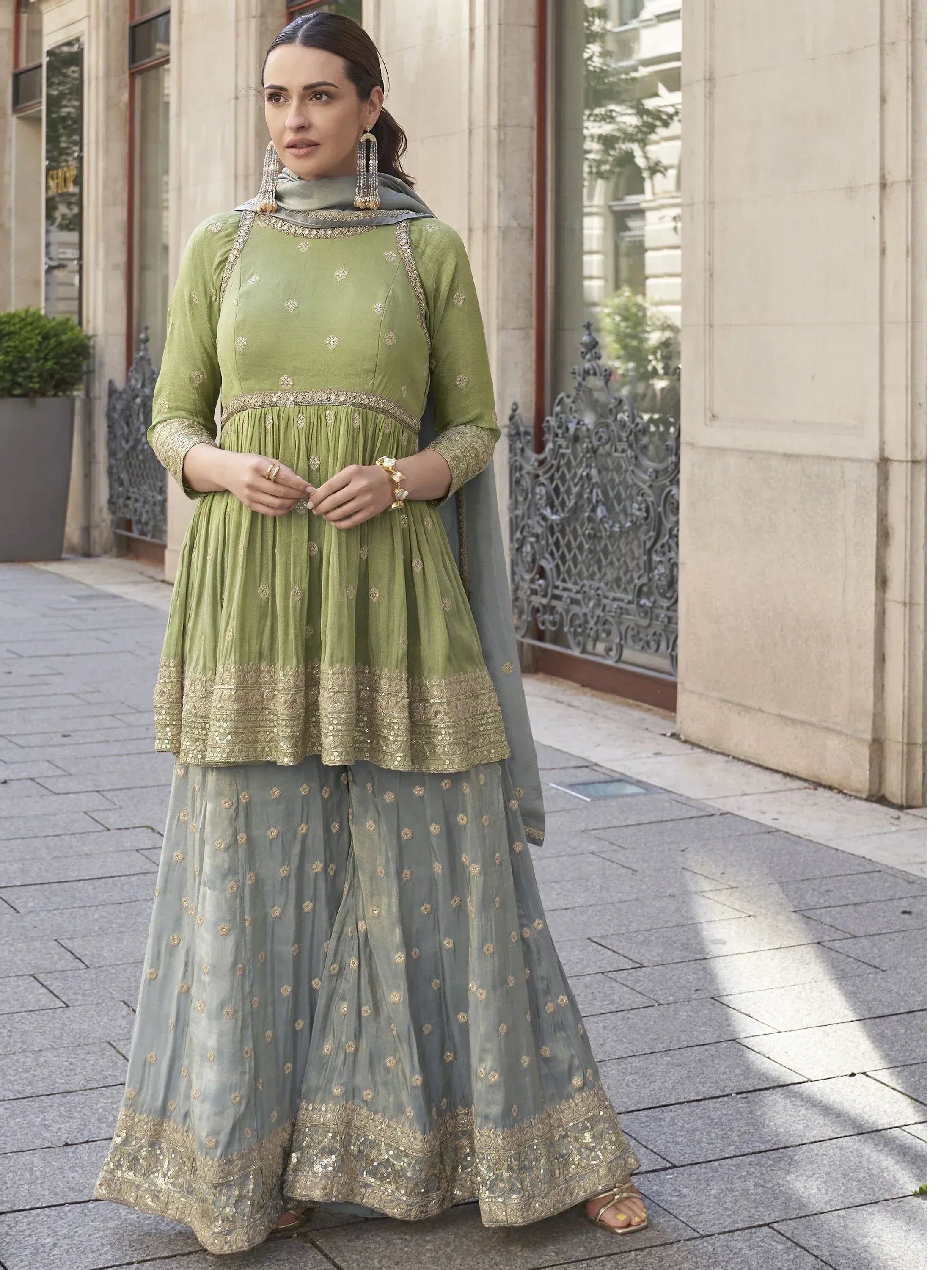 Green and grey embroidered Indian anarkali suit with gold detailing, perfect for ethnic occasions.