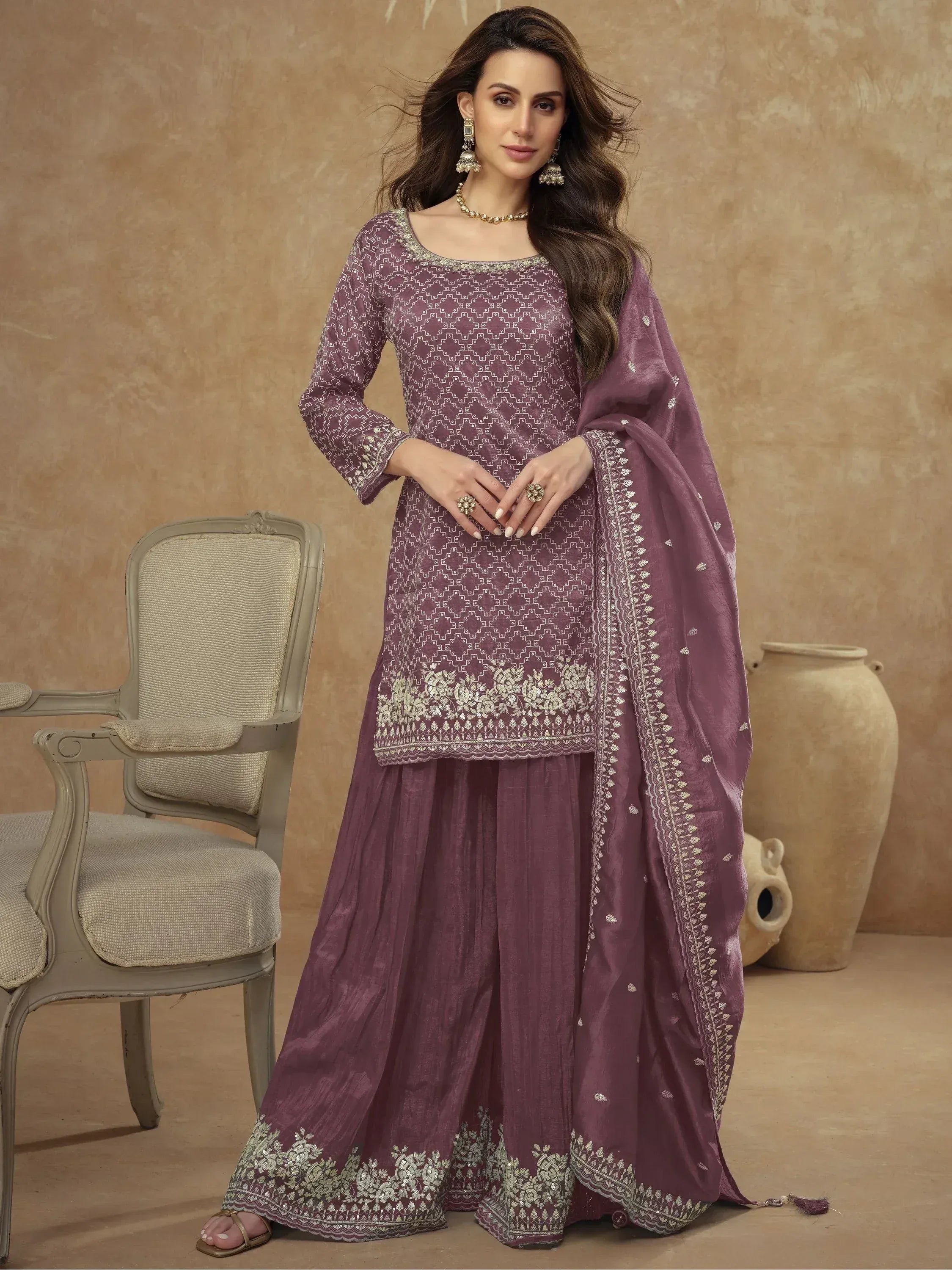 Elegant purple salwar kameez with intricate embroidery and matching dupatta, perfect for Indian ethnic occasions.