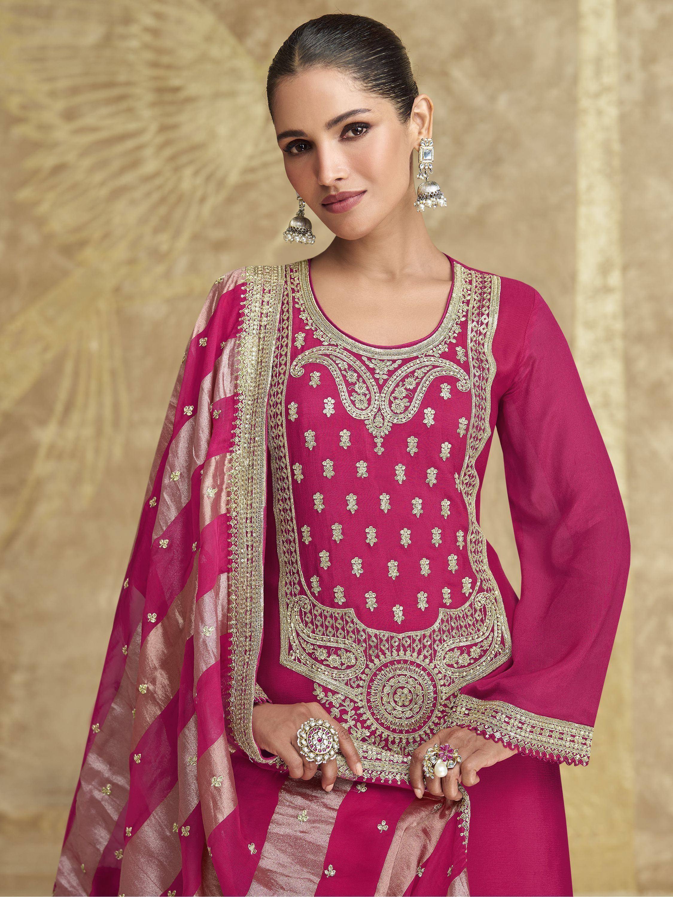 Elegant pink salwar kameez with gold embroidery and matching dupatta for festive occasions