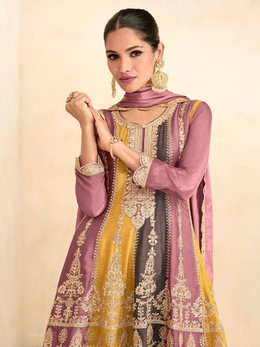Elegant purple and gold embroidered salwar kameez with matching dupatta, perfect for festive occasions.