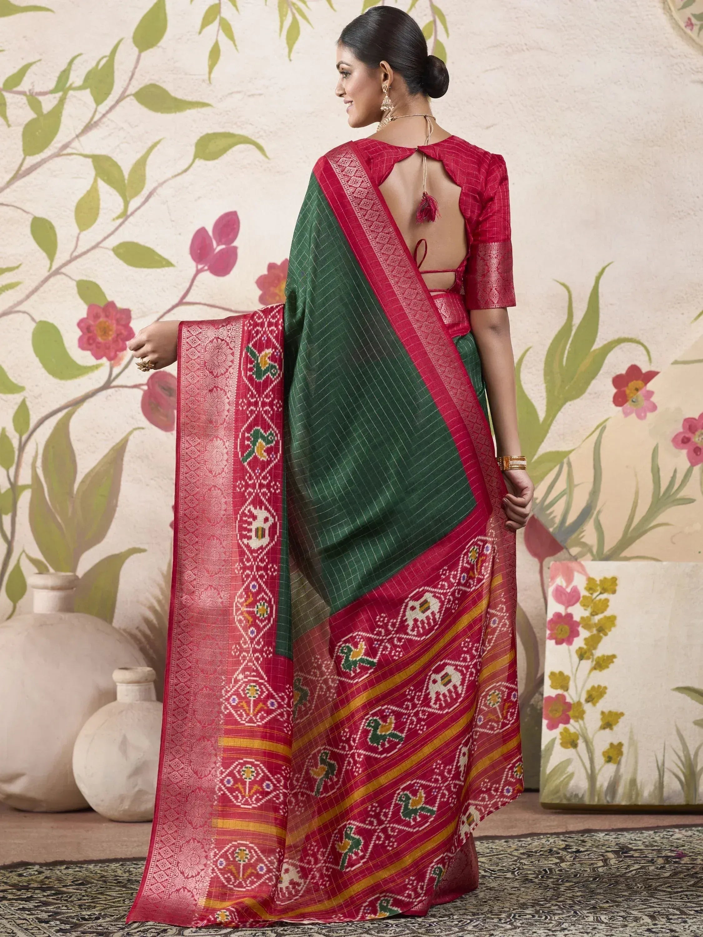 Green and red ethnic saree with elephant and bird motifs, backless blouse, traditional Indian wear