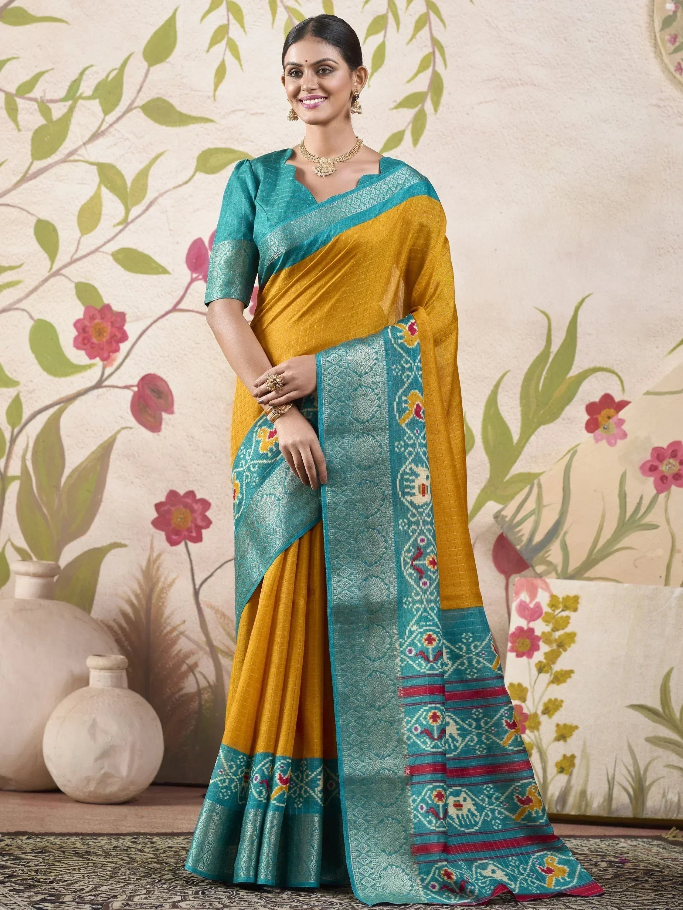 Yellow and teal designer saree with embroidered border, perfect for Indian ethnic wear occasions