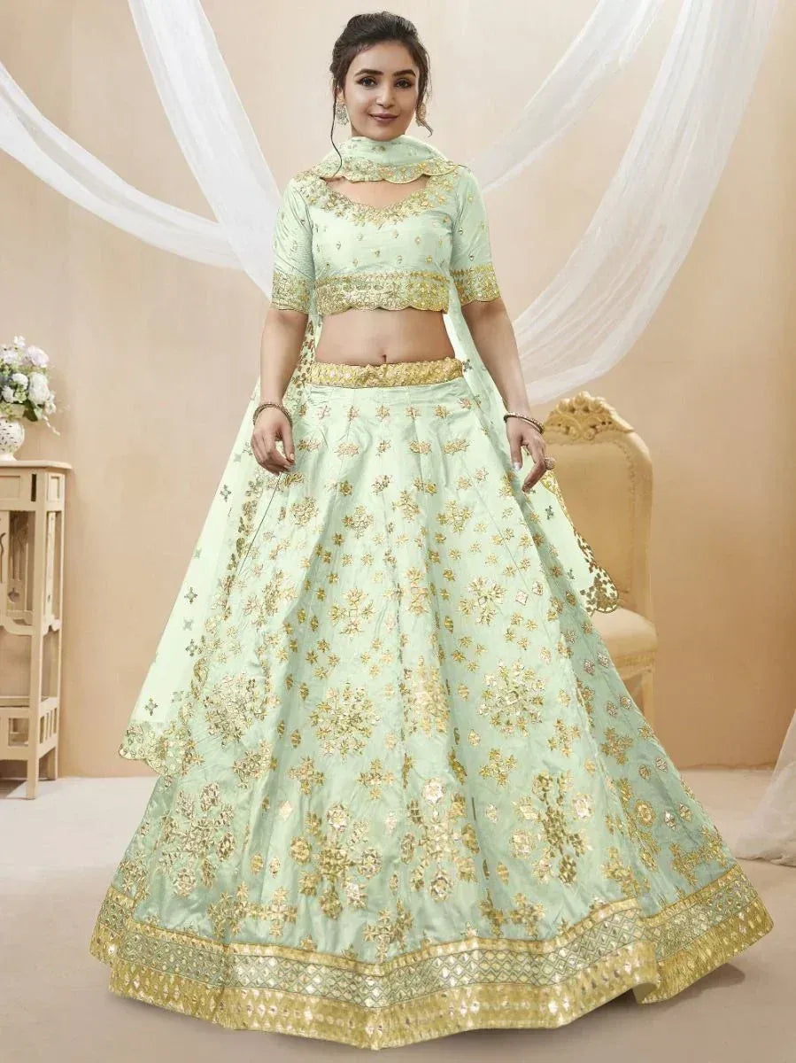 Mint green designer lehenga choli with gold embroidery, perfect for weddings and festive occasions