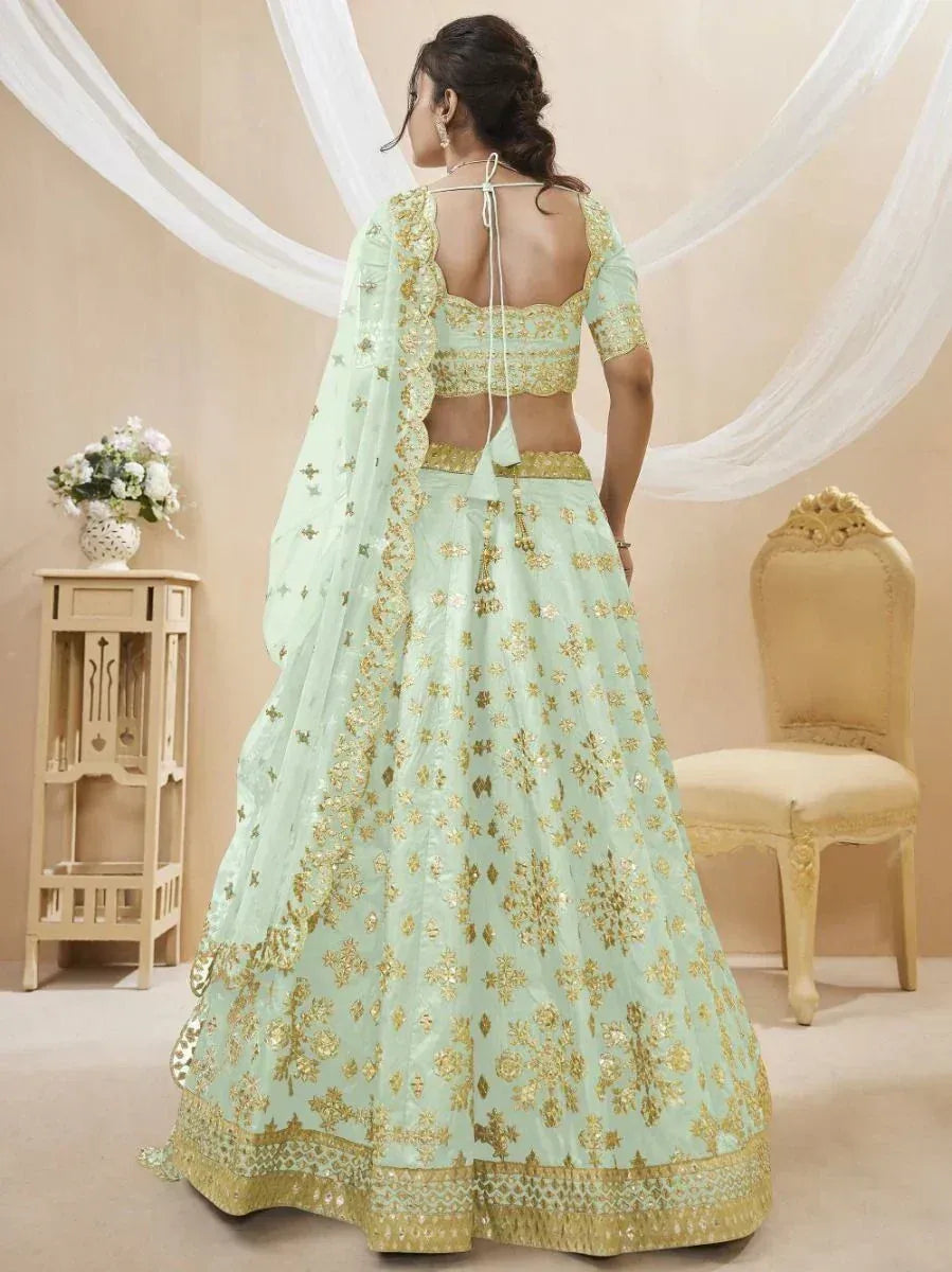 Mint green designer lehenga choli with gold embroidery, back view, ethnic wear