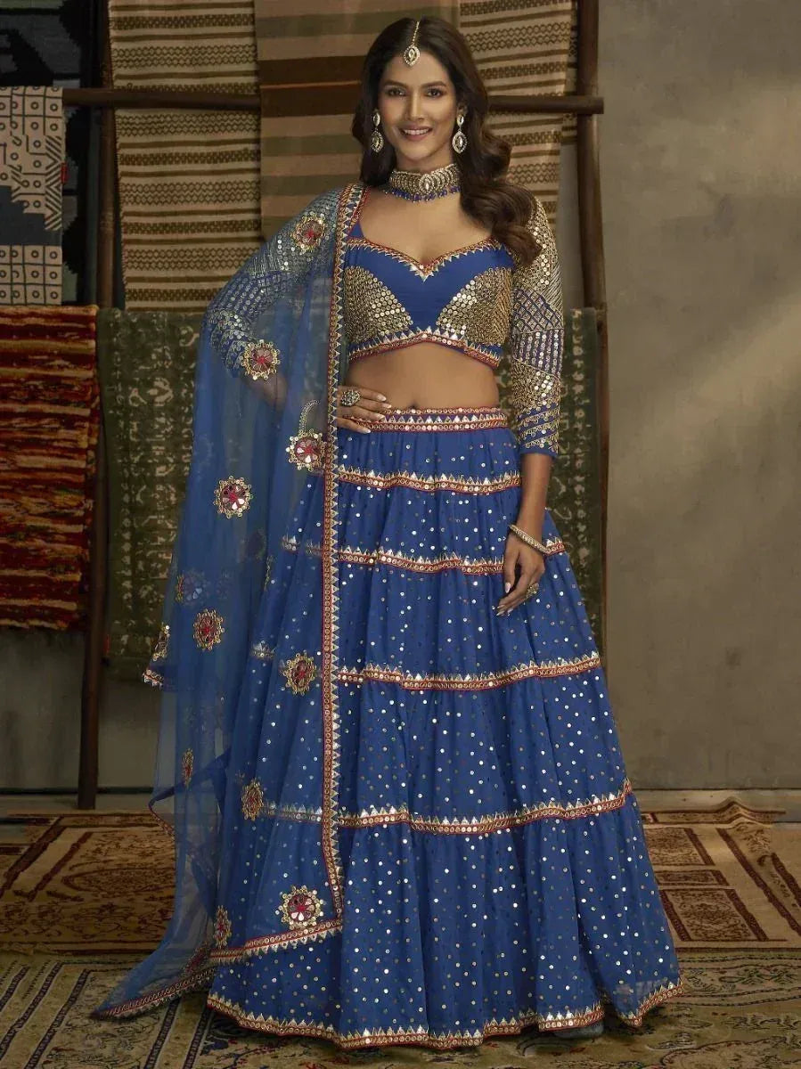 Blue designer lehenga choli with gold mirror work and floral embroidery, perfect for Indian ethnic wear occasions