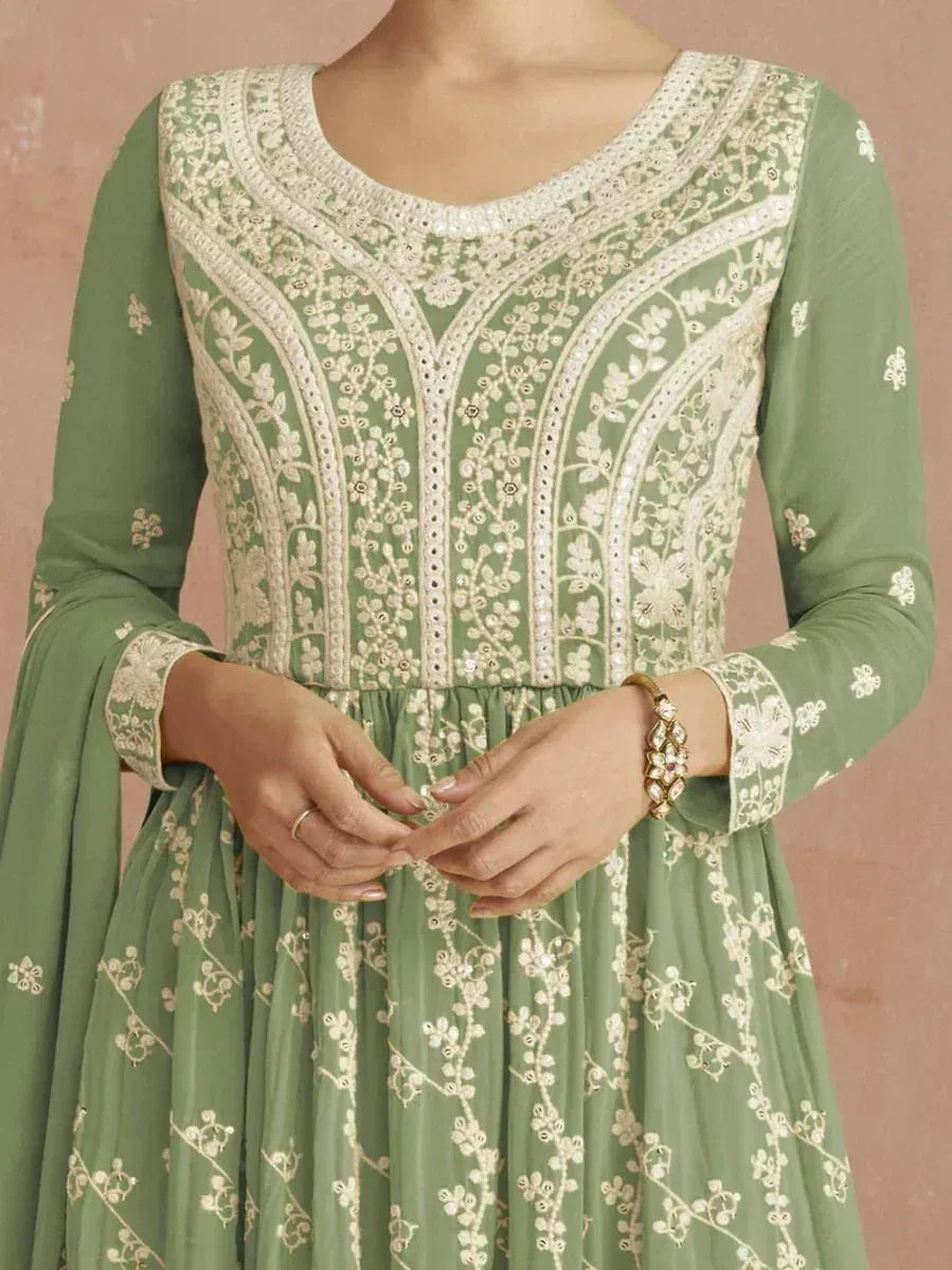 Pastel green ethnic gown with white floral embroidery and long sleeves