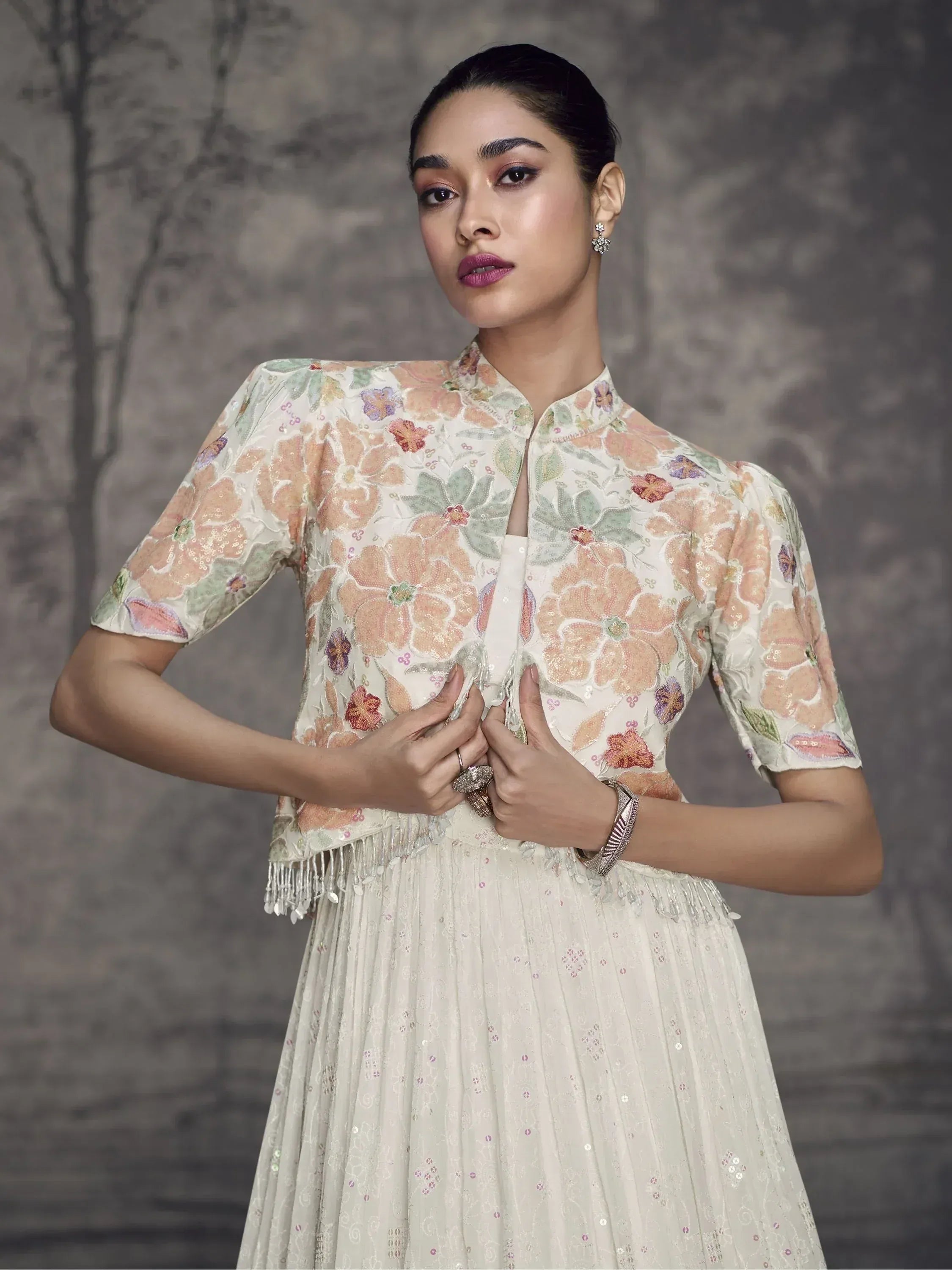 Floral embroidered Indian ethnic gown with sequin detailing and mandarin collar, perfect for festive occasions.