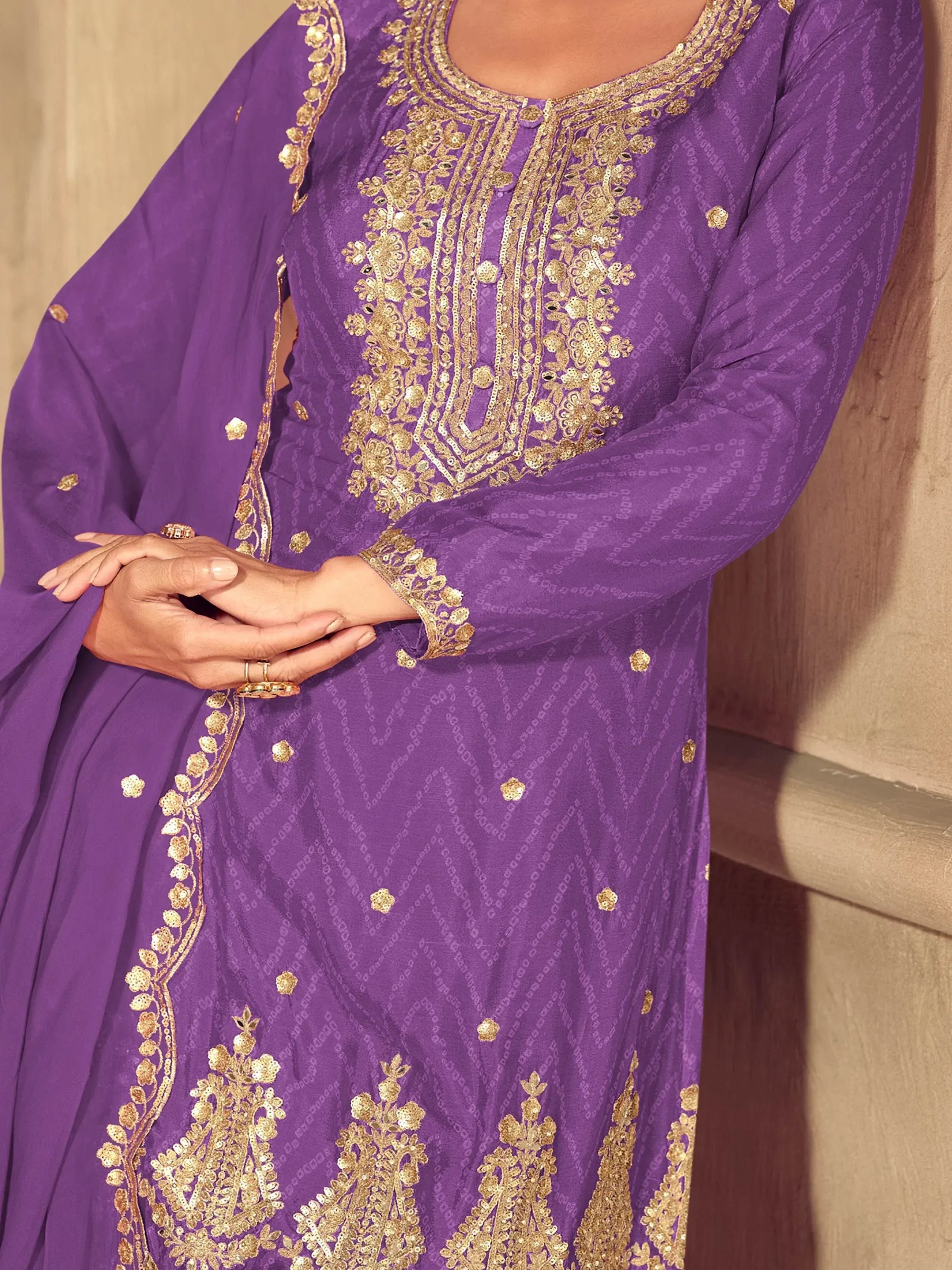 Purple ethnic kurti with gold embroidery and sequin work, perfect for festive occasions