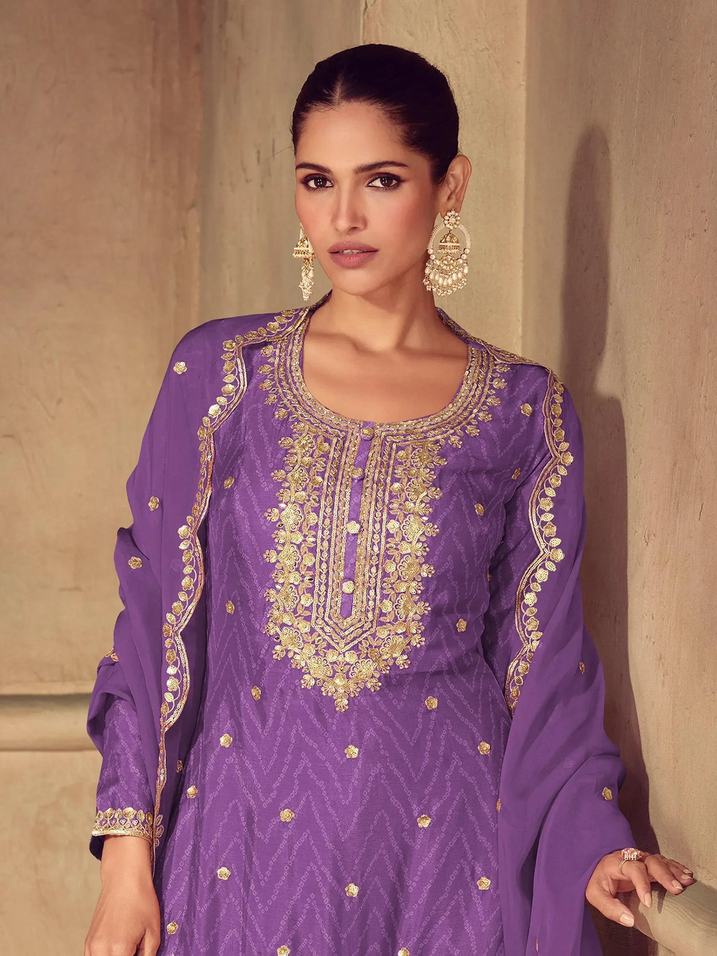 Purple ethnic kurti with gold embroidery, perfect for Indian festive wear and designer occasions.