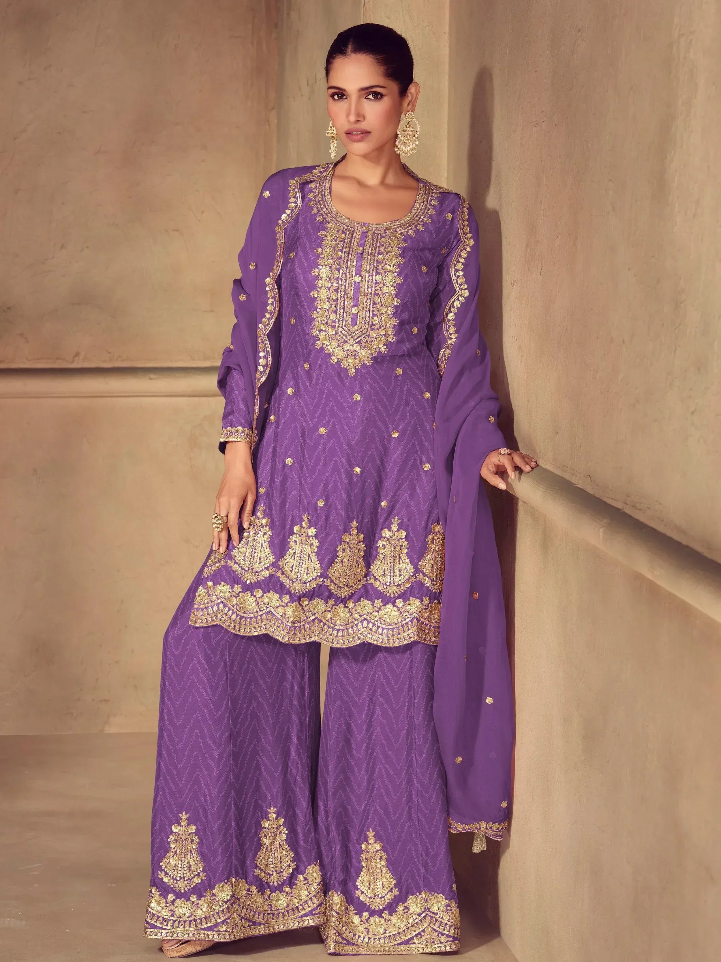 Purple Indian ethnic salwar kameez with gold embroidery, perfect for festive occasions and weddings.