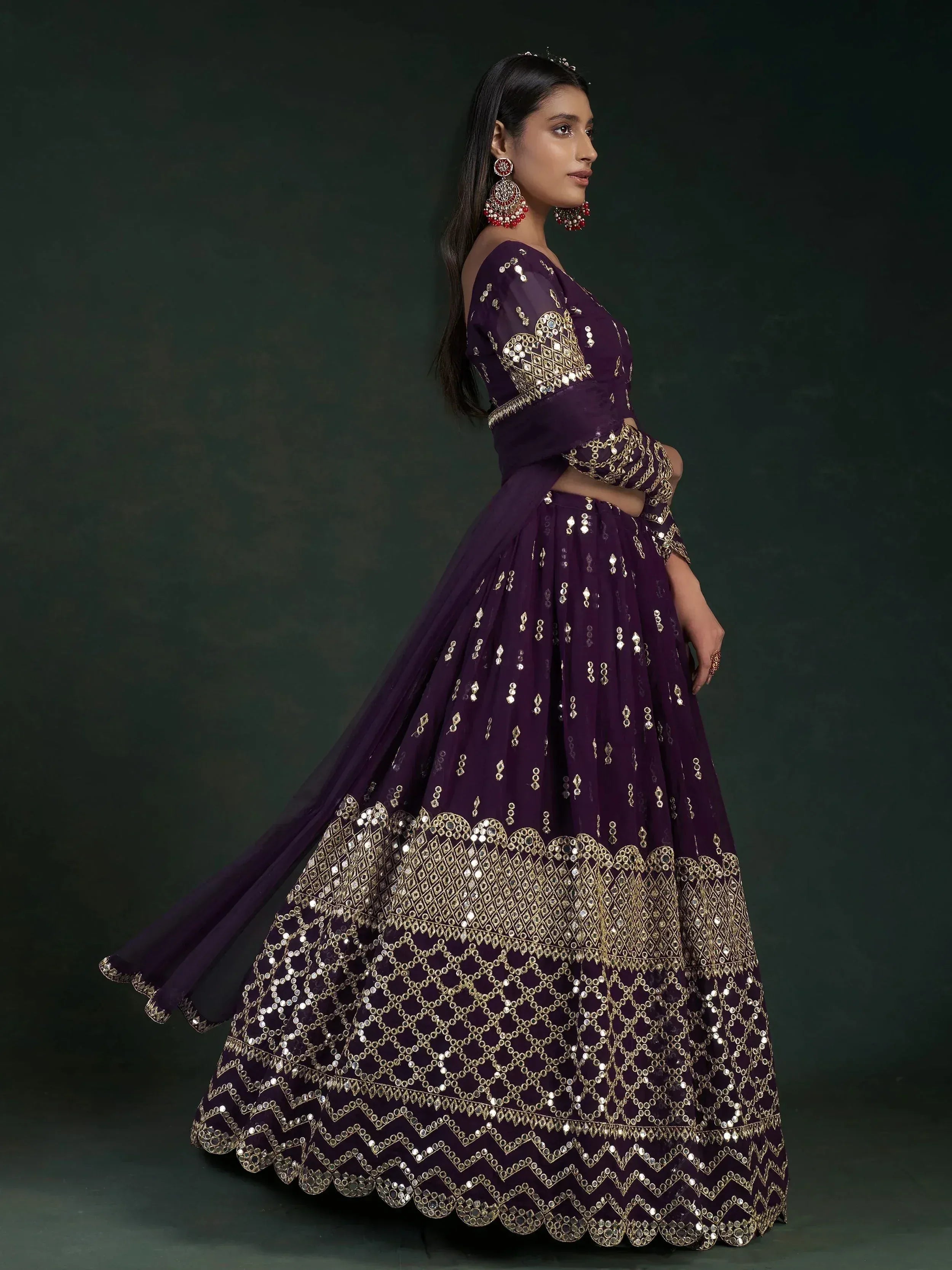 Elegant purple lehenga choli with gold mirror work, perfect for Indian ethnic wear and festive occasions.