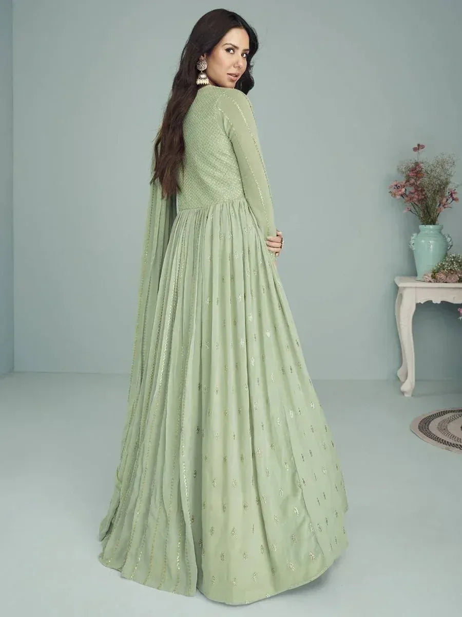 Mint green ethnic gown with gold embroidery, long sleeves, and flared skirt for women