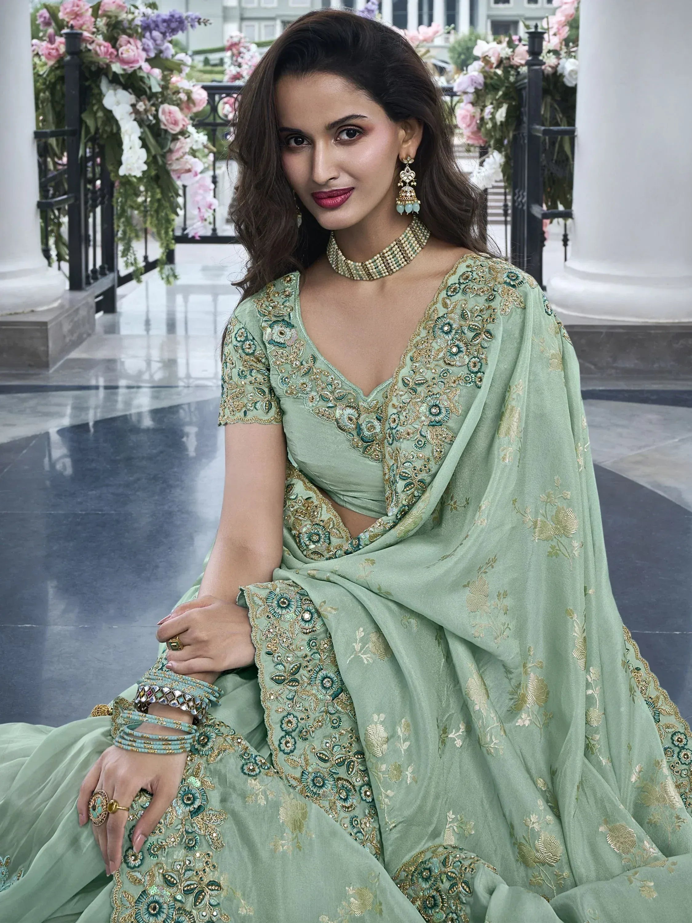 Mint green embroidered lehenga choli with gold floral detailing, perfect for Indian ethnic wear occasions.