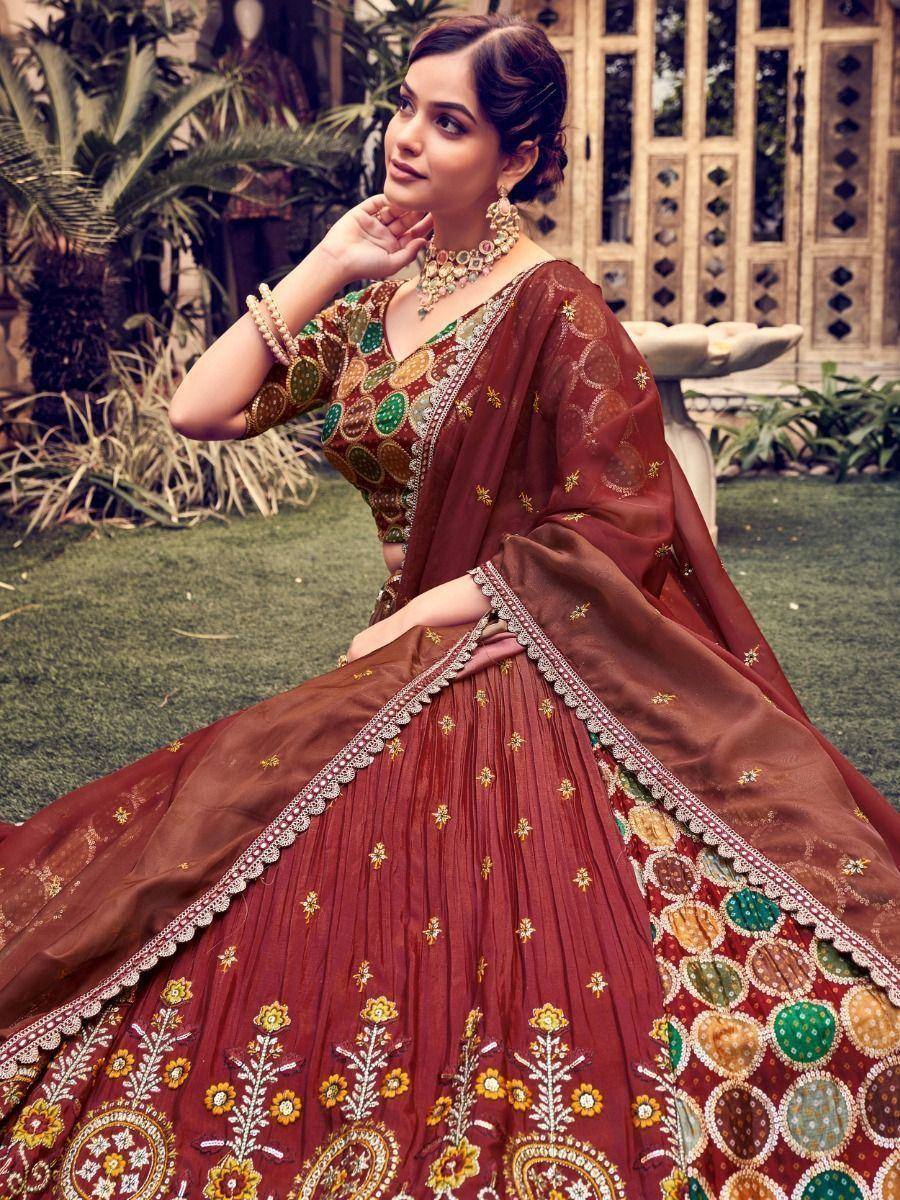 Maroon embroidered lehenga choli with floral motifs, perfect for Indian ethnic wear occasions