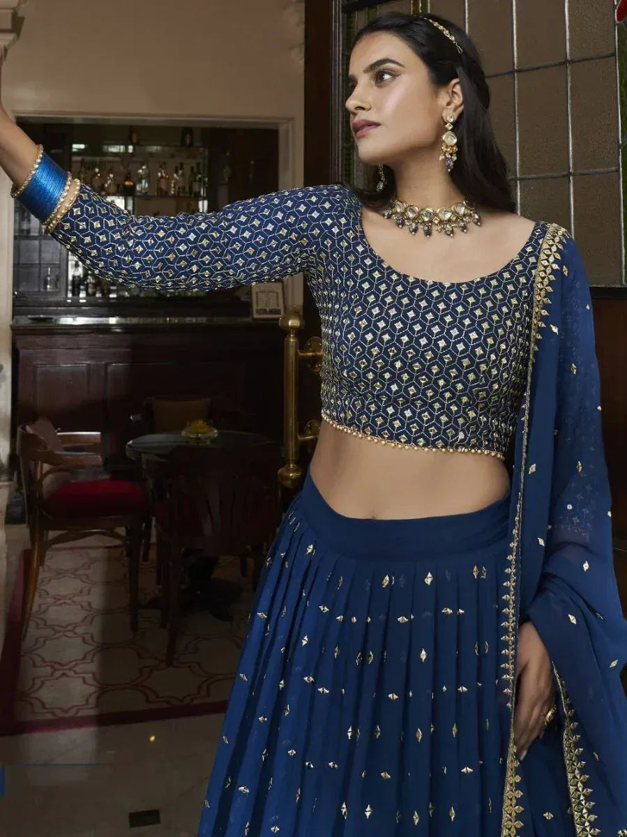 Blue embroidered lehenga choli with gold detailing, perfect for Indian ethnic wear occasions