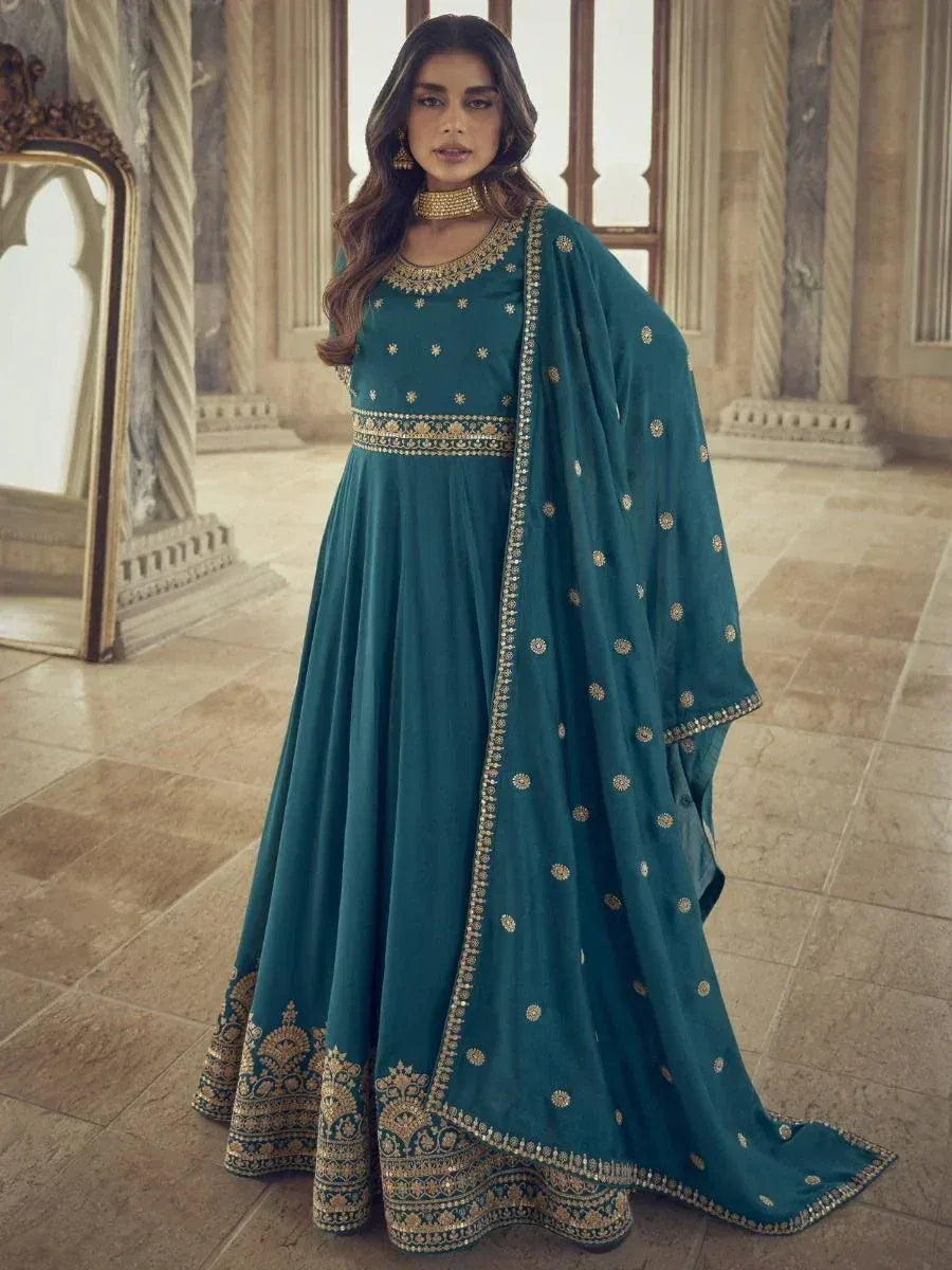 Teal Indian ethnic anarkali suit with gold embroidery, perfect for weddings and festive occasions.