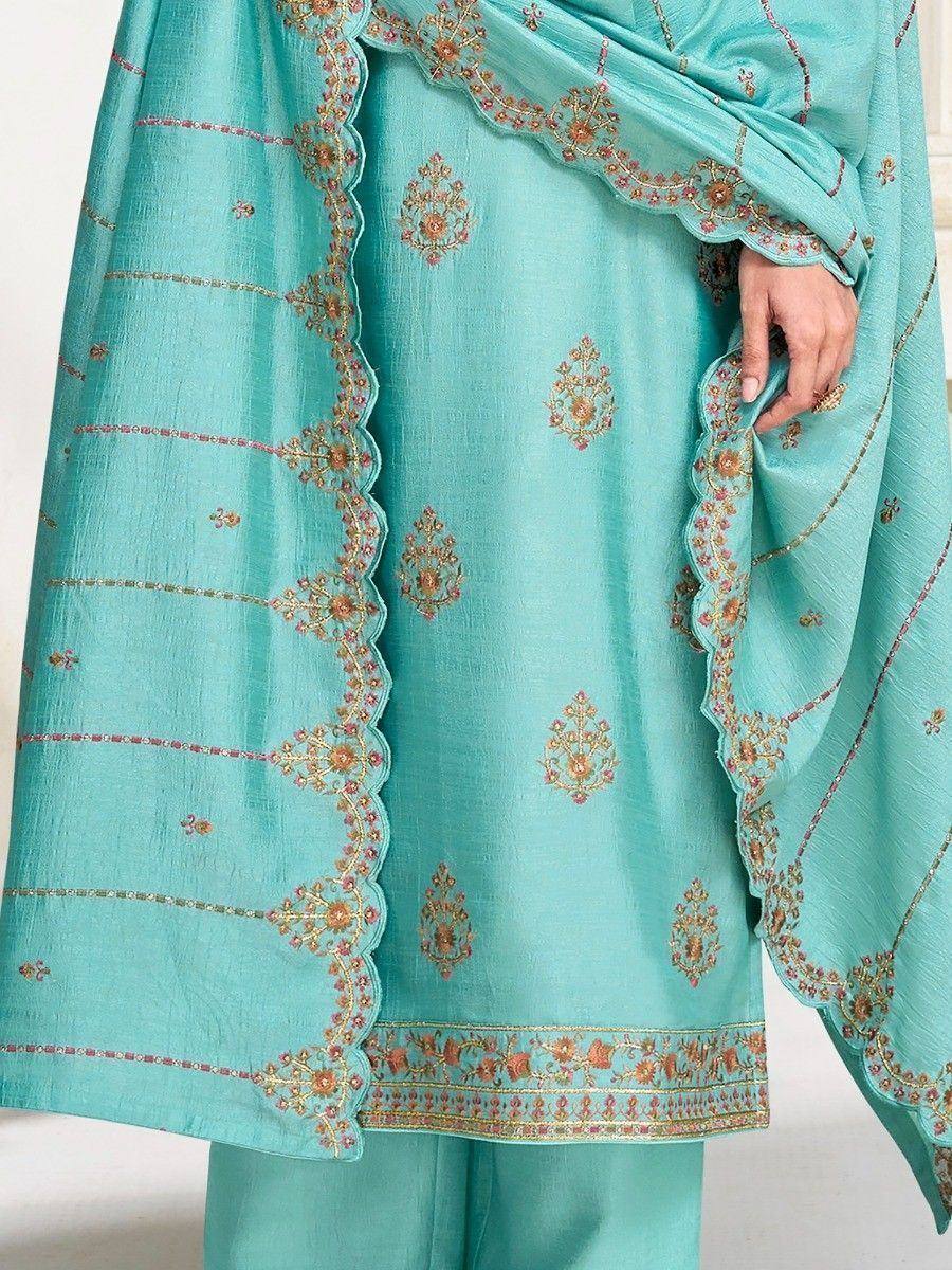 Turquoise embroidered salwar kameez with scalloped dupatta, floral motifs, and gold thread detailing