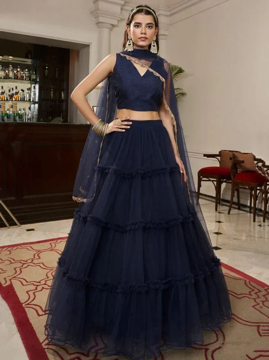 Navy blue tiered lehenga choli with sheer dupatta, perfect for Indian ethnic wear occasions