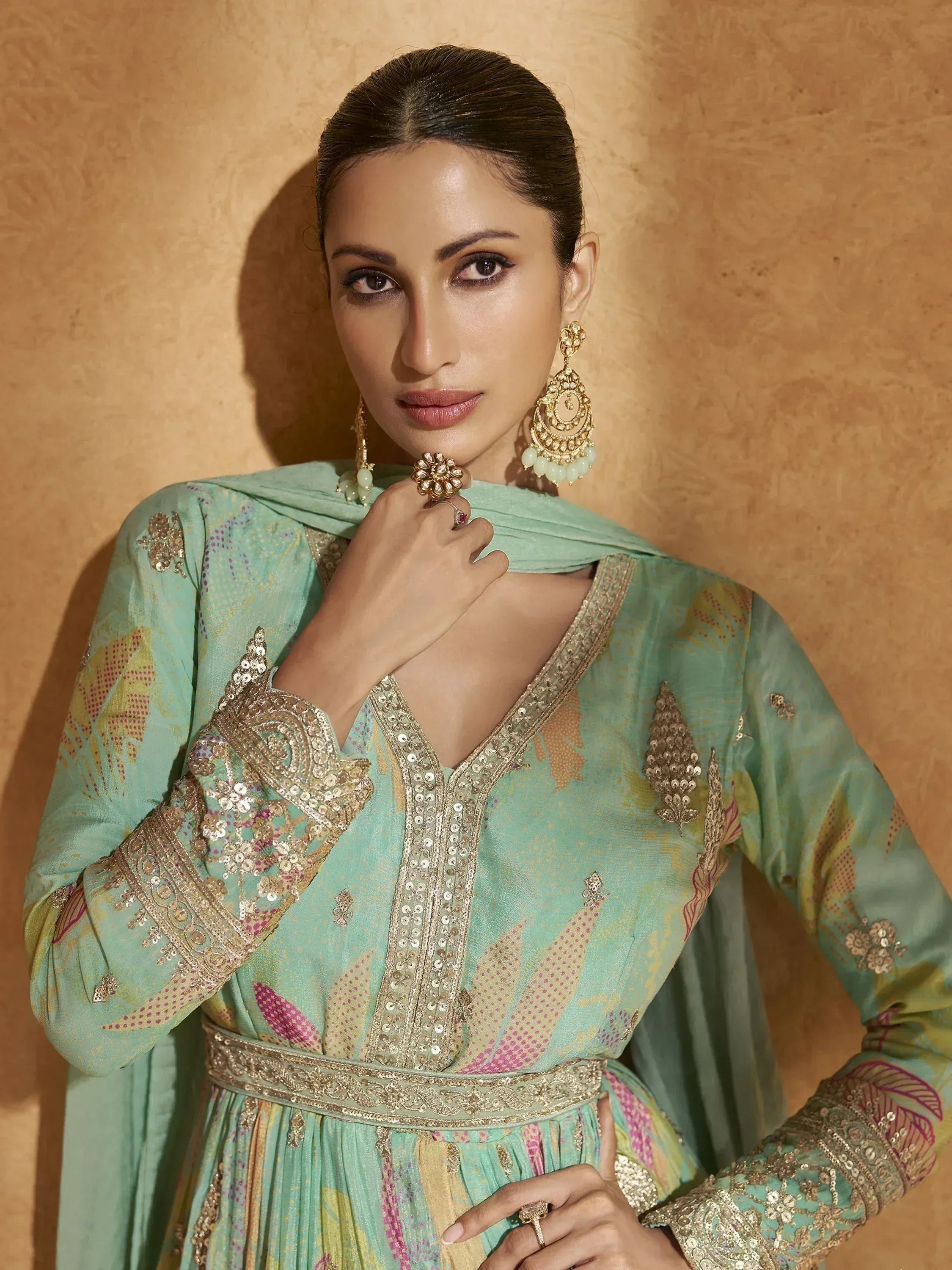 Mint green embroidered anarkali suit with gold detailing, perfect for Indian ethnic wear occasions.