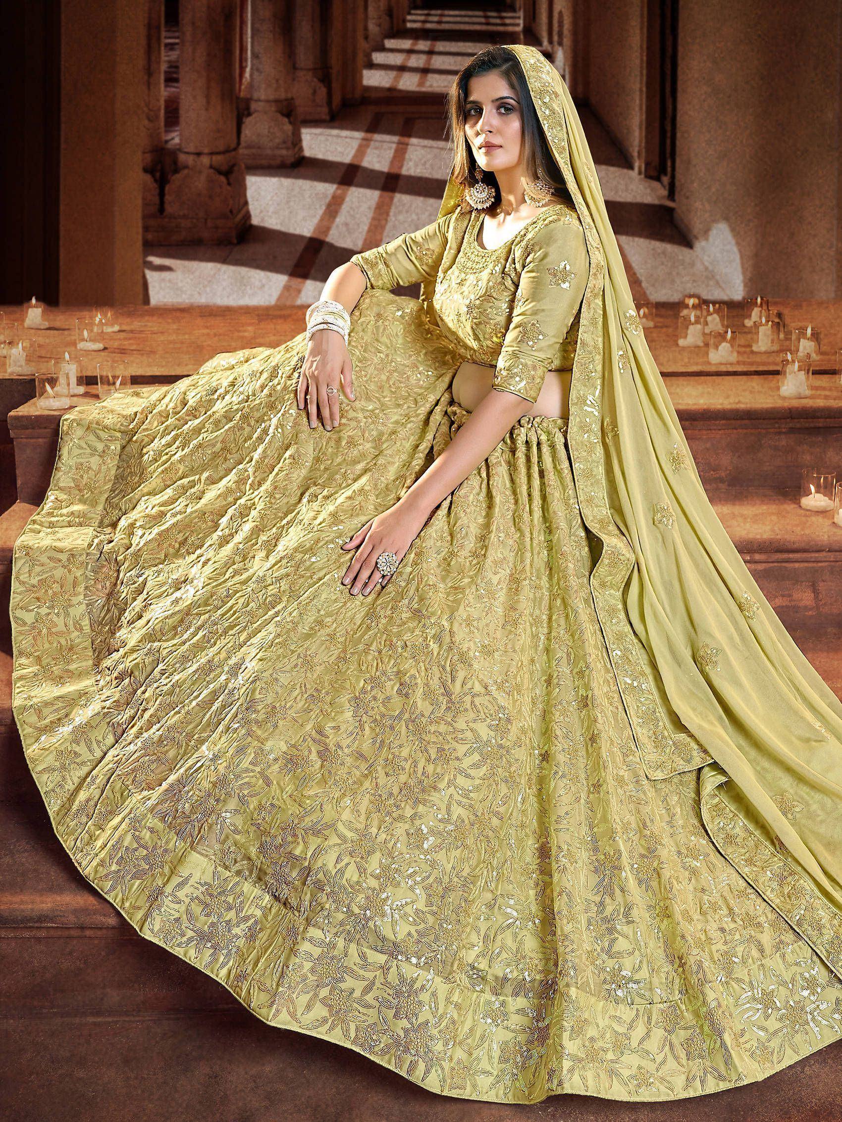 Elegant olive green designer lehenga choli with intricate floral embroidery and sequins, perfect for Indian weddings.