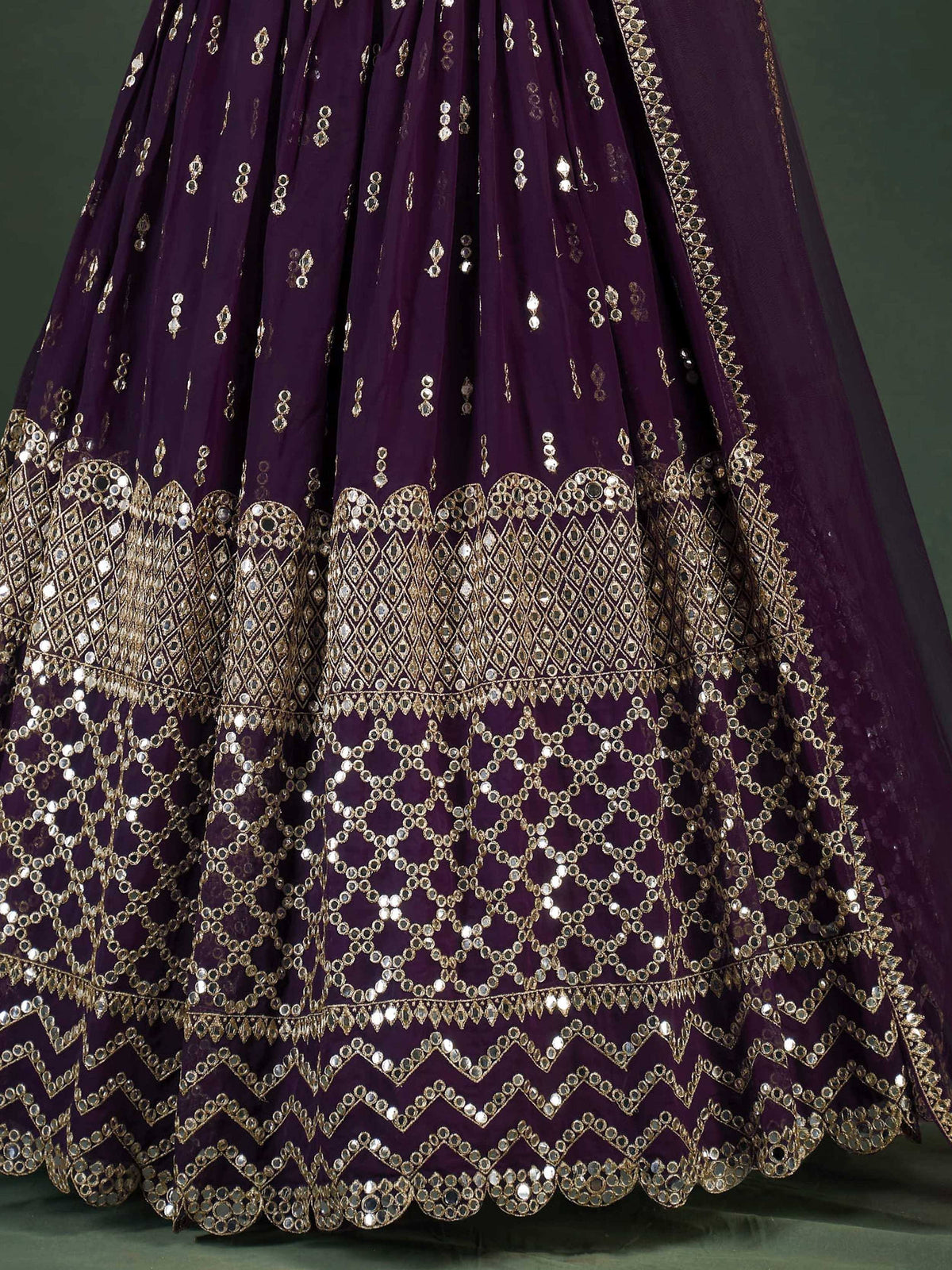 Purple lehenga with gold mirror work and intricate embroidery, perfect for Indian ethnic wear