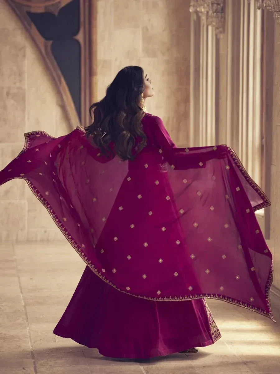 Elegant maroon ethnic gown with gold embroidery, flowing dupatta, perfect for Indian weddings and festive occasions
