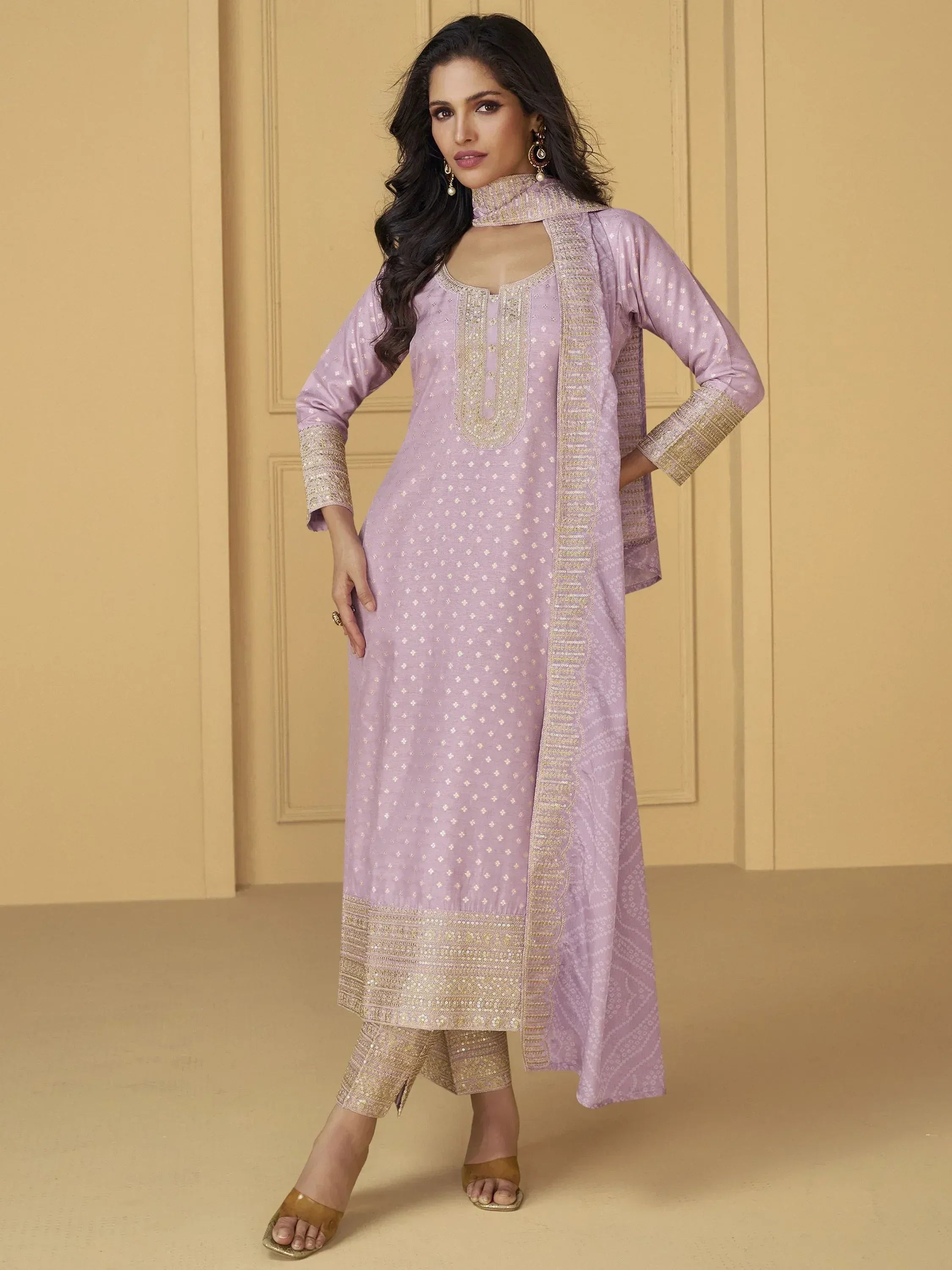 Lavender ethnic salwar kameez with gold embroidery, perfect for Indian festive wear