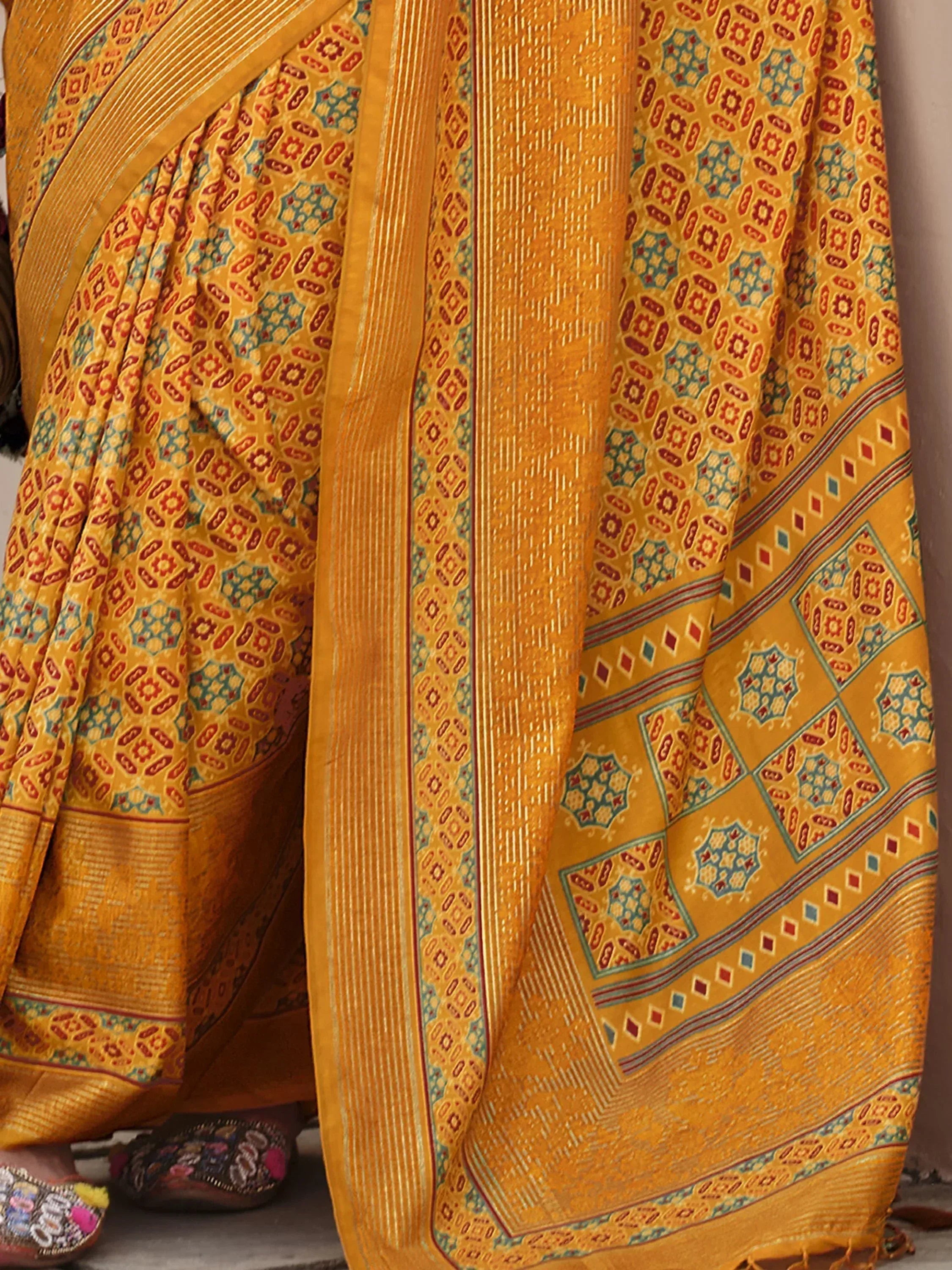 Yellow ethnic saree with red and blue geometric print, traditional Indian wear