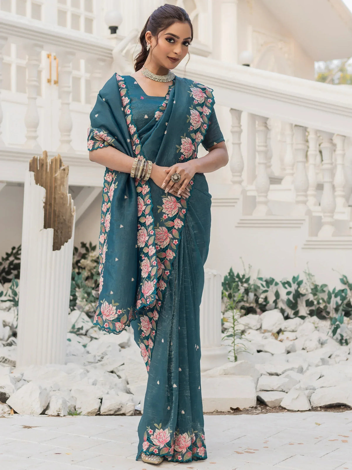 Teal floral embroidered saree with matching blouse, styled for Indian ethnic wear occasions