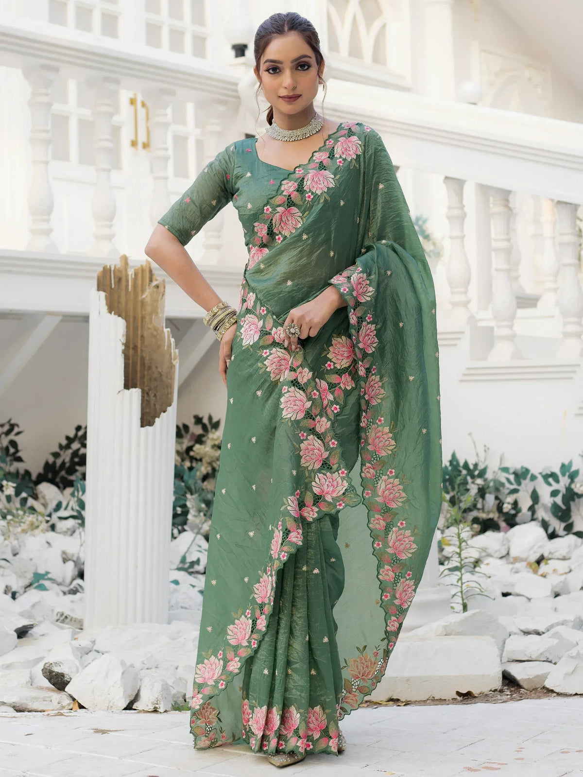 Green floral embroidered saree with pink flowers, perfect for Indian ethnic wear occasions.