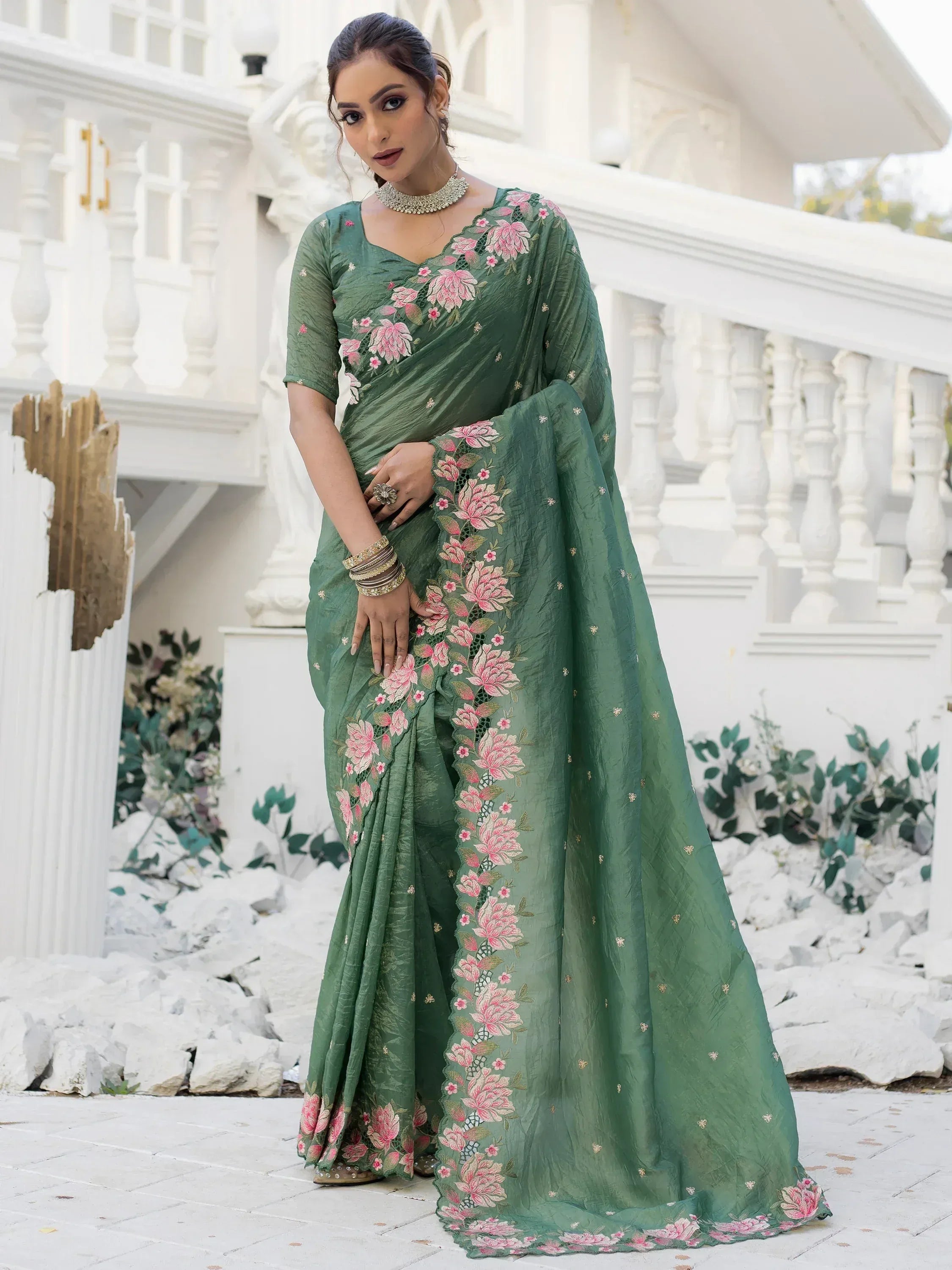 Green floral embroidered saree with pink flowers, perfect for Indian ethnic wear occasions.