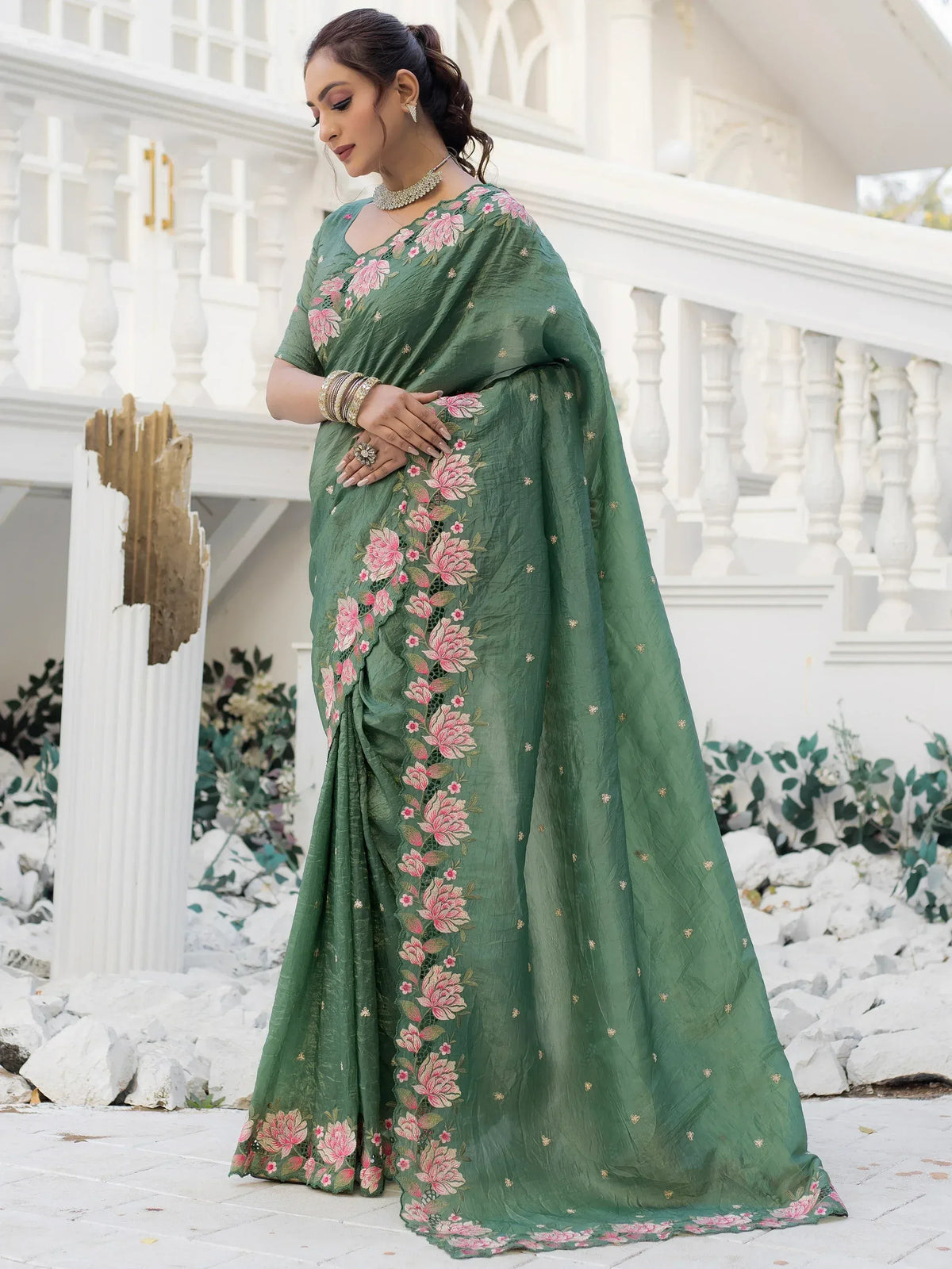 Green floral embroidered saree with pink flowers, perfect for Indian ethnic wear occasions.