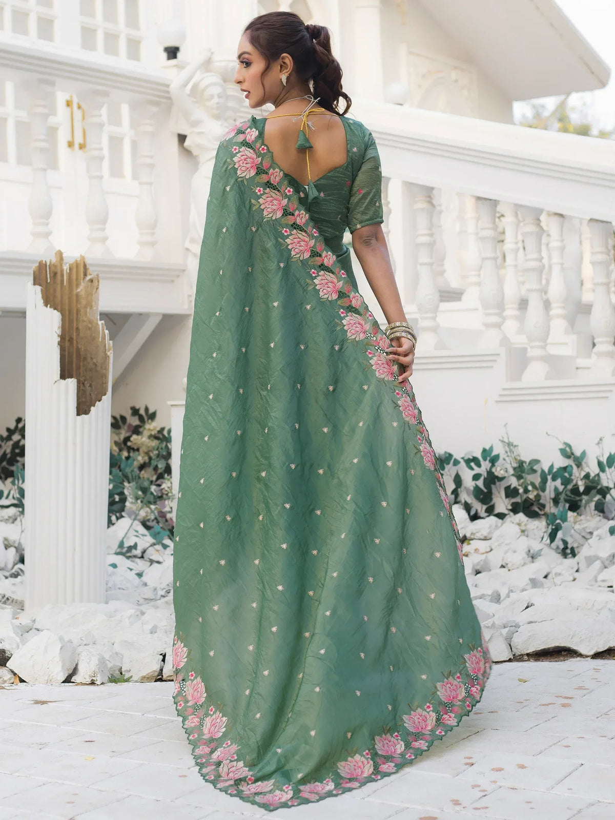 Green floral embroidered ethnic gown with backless design, perfect for Indian occasions