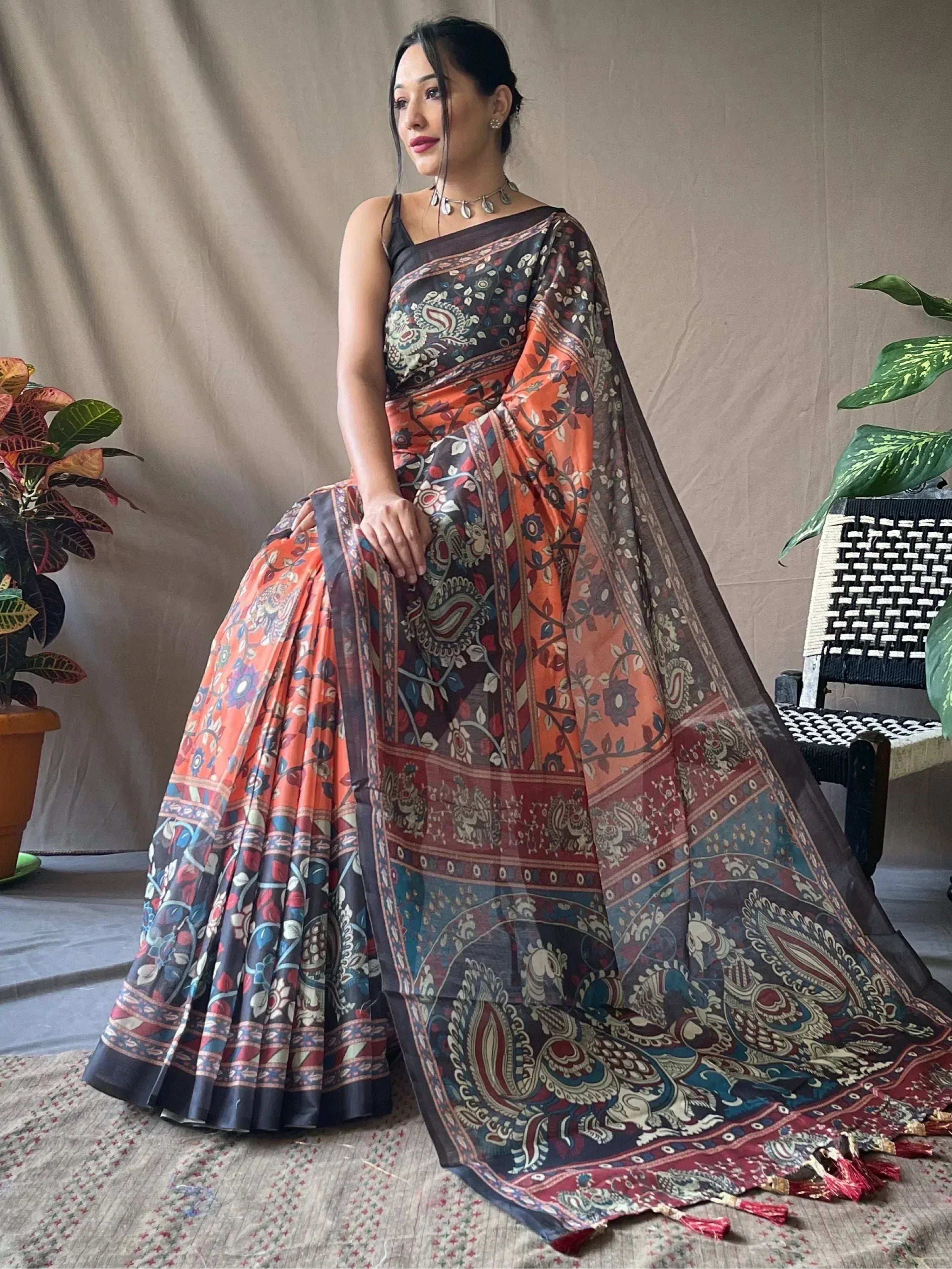 Woman in vibrant printed saree with paisley motifs, perfect for Indian ethnic wear occasions
