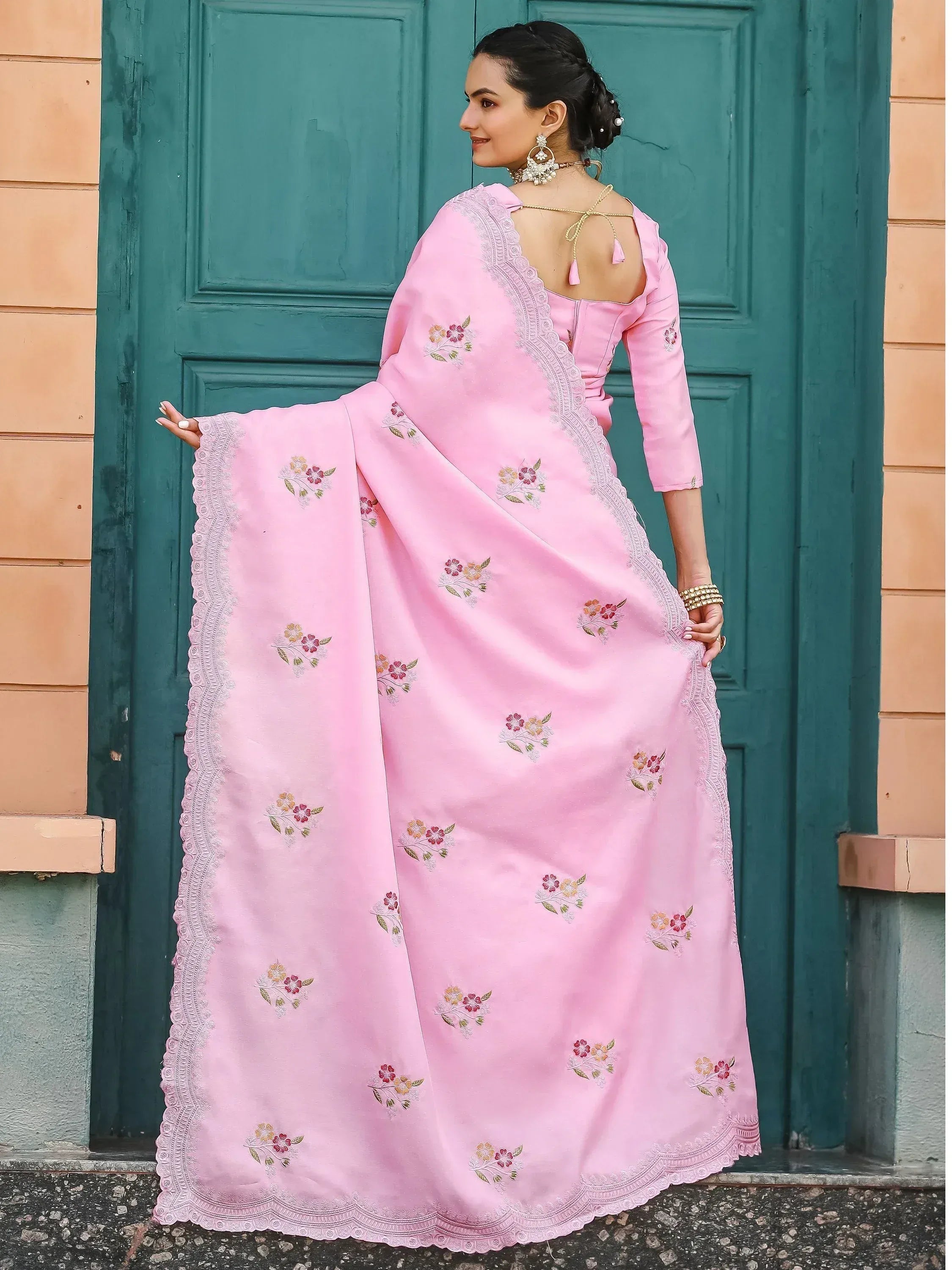 Pink floral embroidered ethnic gown with lace detailing, perfect for Indian occasions