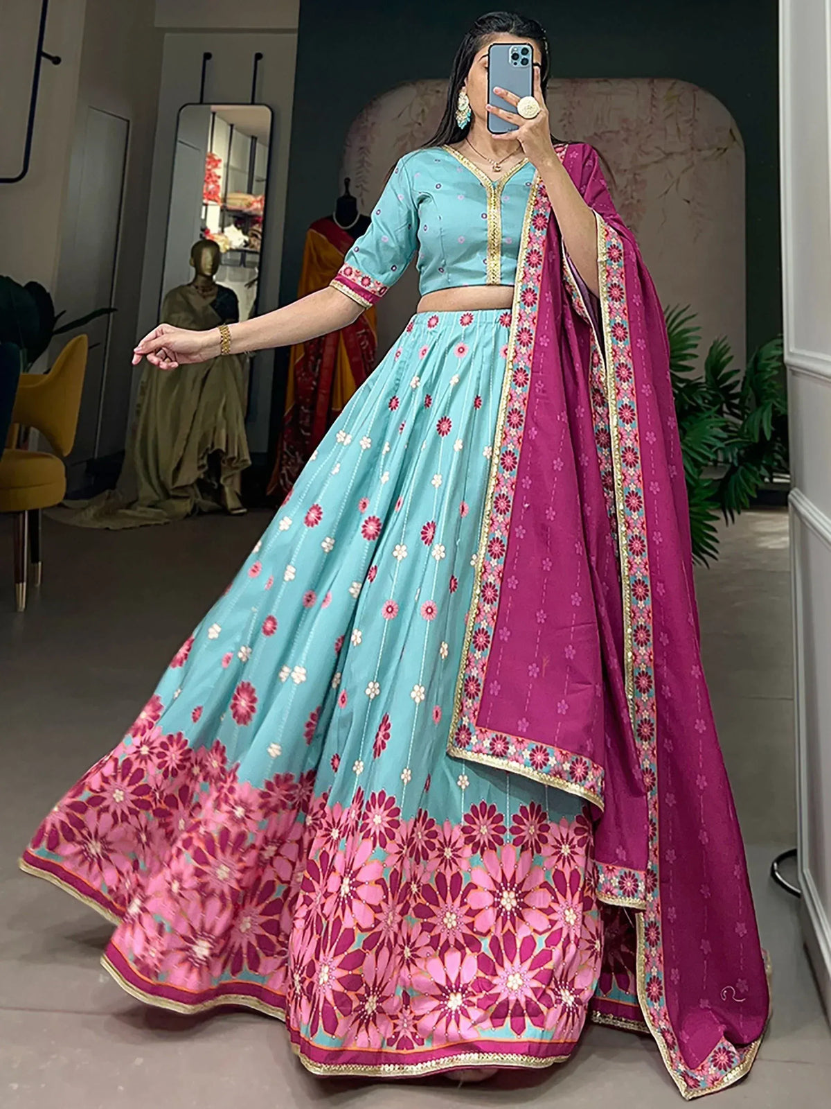Turquoise and magenta floral lehenga choli with embroidered dupatta, perfect for Indian ethnic occasions